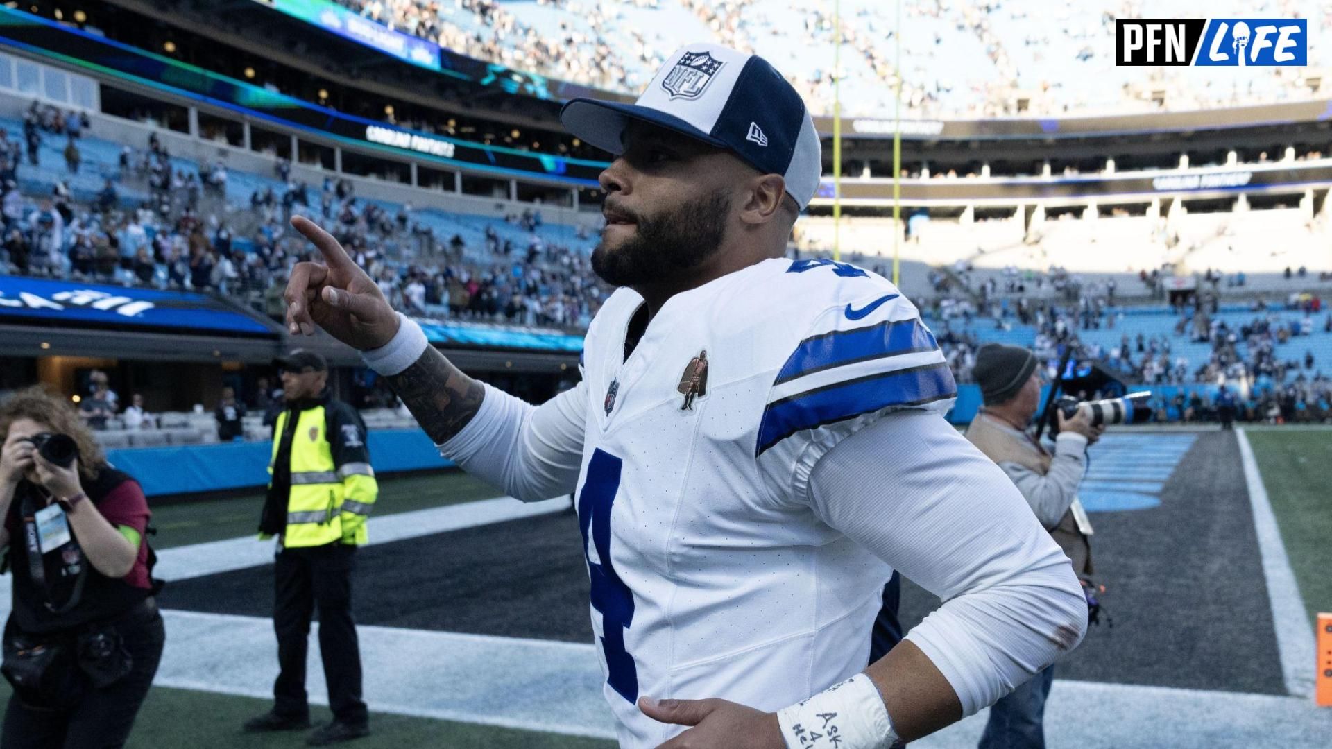Dallas Cowboys quarterback Dak Prescott (4) runs off the field after the game at Bank of America Stadium.
