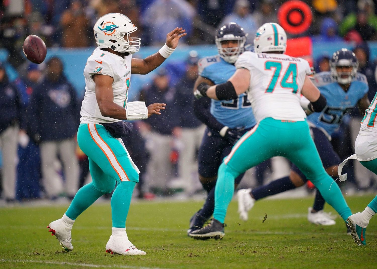 Miami Dolphins quarterback Tua Tagovailoa (1) fumbles the ball during the first quarter at Nissan Stadium Sunday, Jan. 2, 2022 in Nashville, Tenn. The ball was recovered by the Titans.