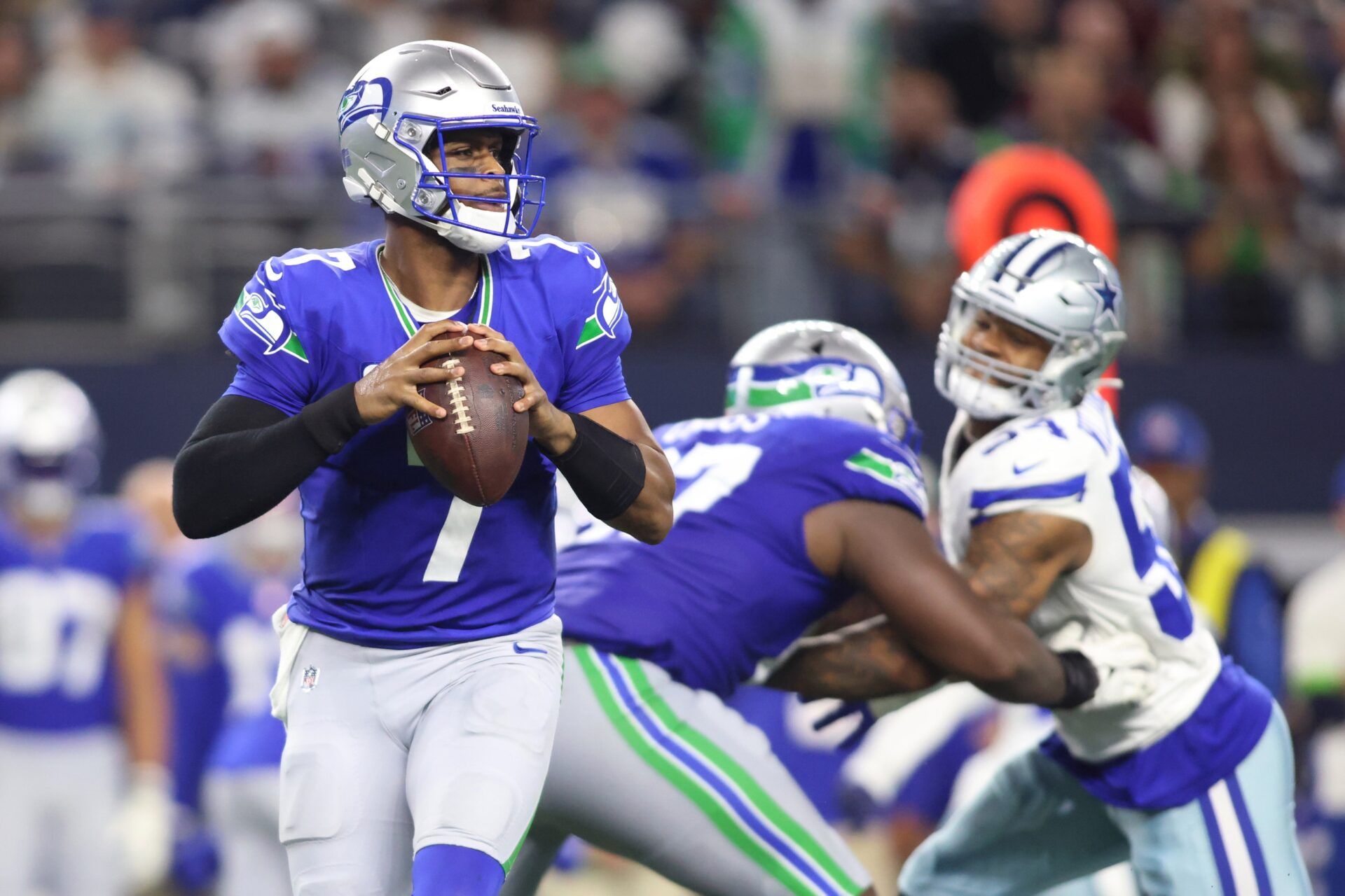 Seattle Seahawks QB Geno Smith (7) looks to pass against the Dallas Cowboys.