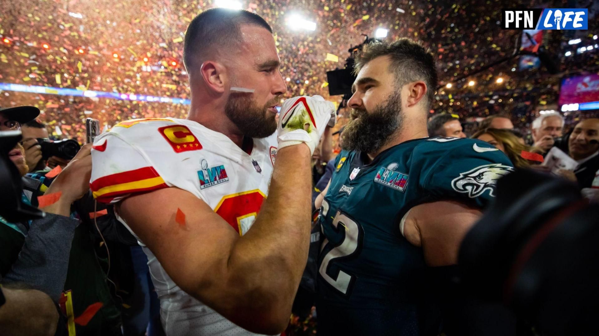 Kansas City Chiefs tight end Travis Kelce (87) talks with his brother Philadelphia Eagles center Jason Kelce (62) after Super Bowl LVII at State Farm Stadium.