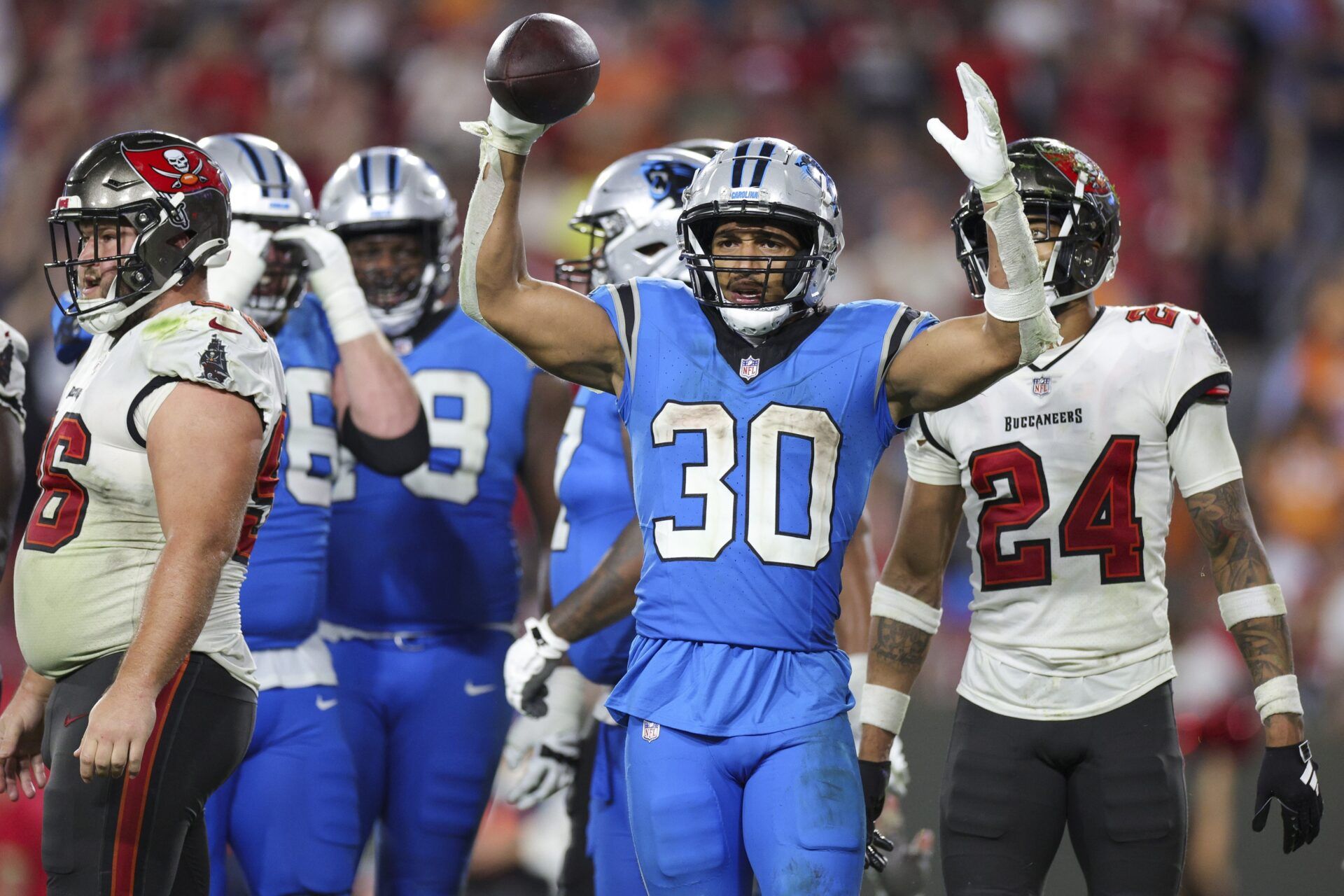 Carolina Panthers running back Chuba Hubbard (30) celebrates after a touchdown against the Tampa Bay Buccaneers in the fourth quarter at Raymond James Stadium.