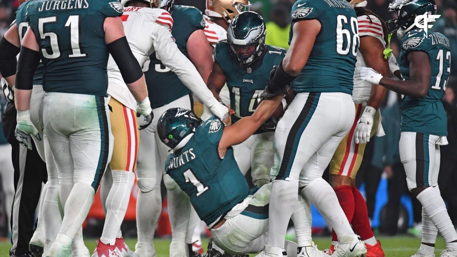 Philadelphia Eagles quarterback Jalen Hurts (1) is helped up after being tackled against the San Francisco 49ers during the third quarter at Lincoln Financial Field.