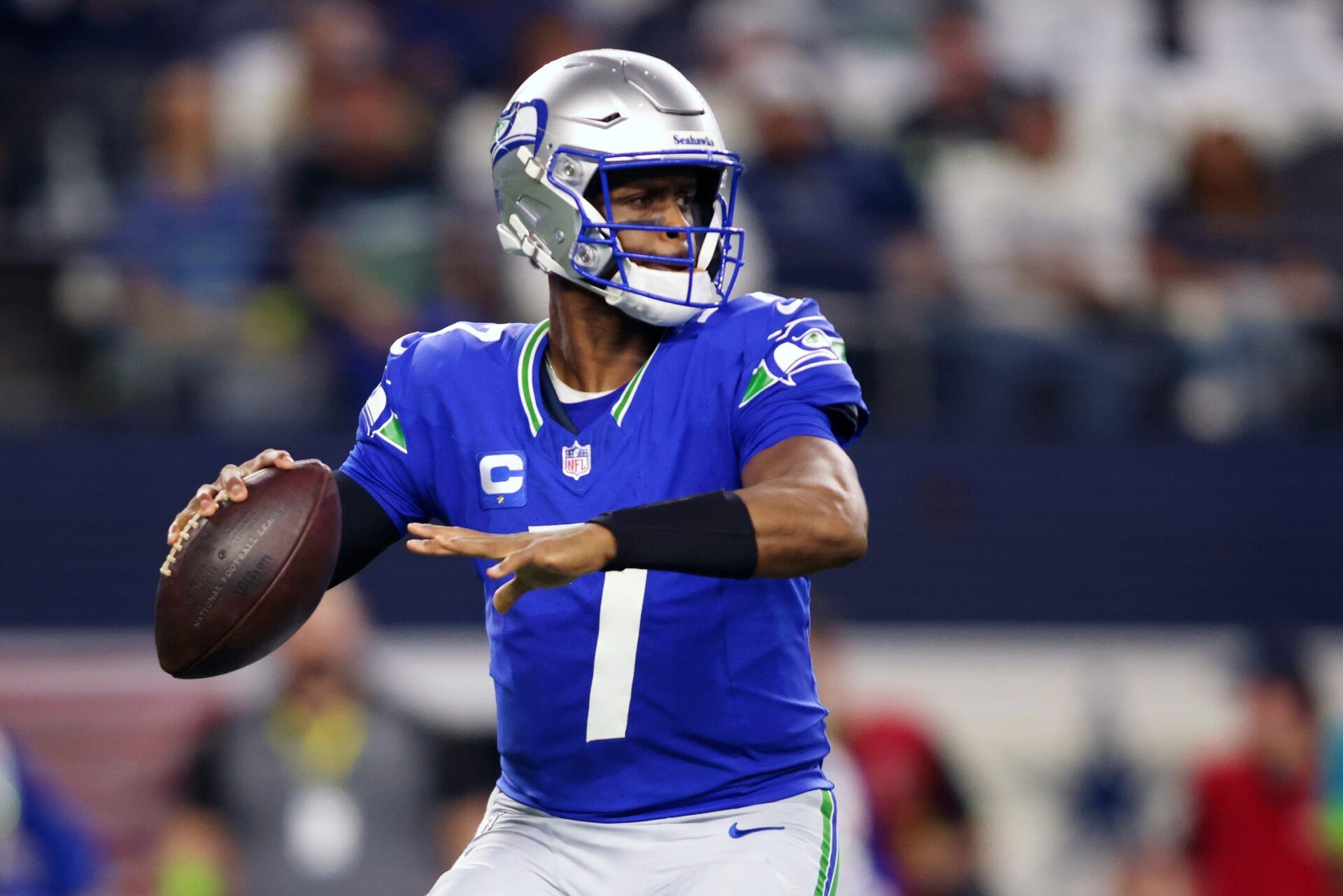 Seattle Seahawks quarterback Geno Smith (7) looks to pass against the Dallas Cowboys during the first half at AT&T Stadium.