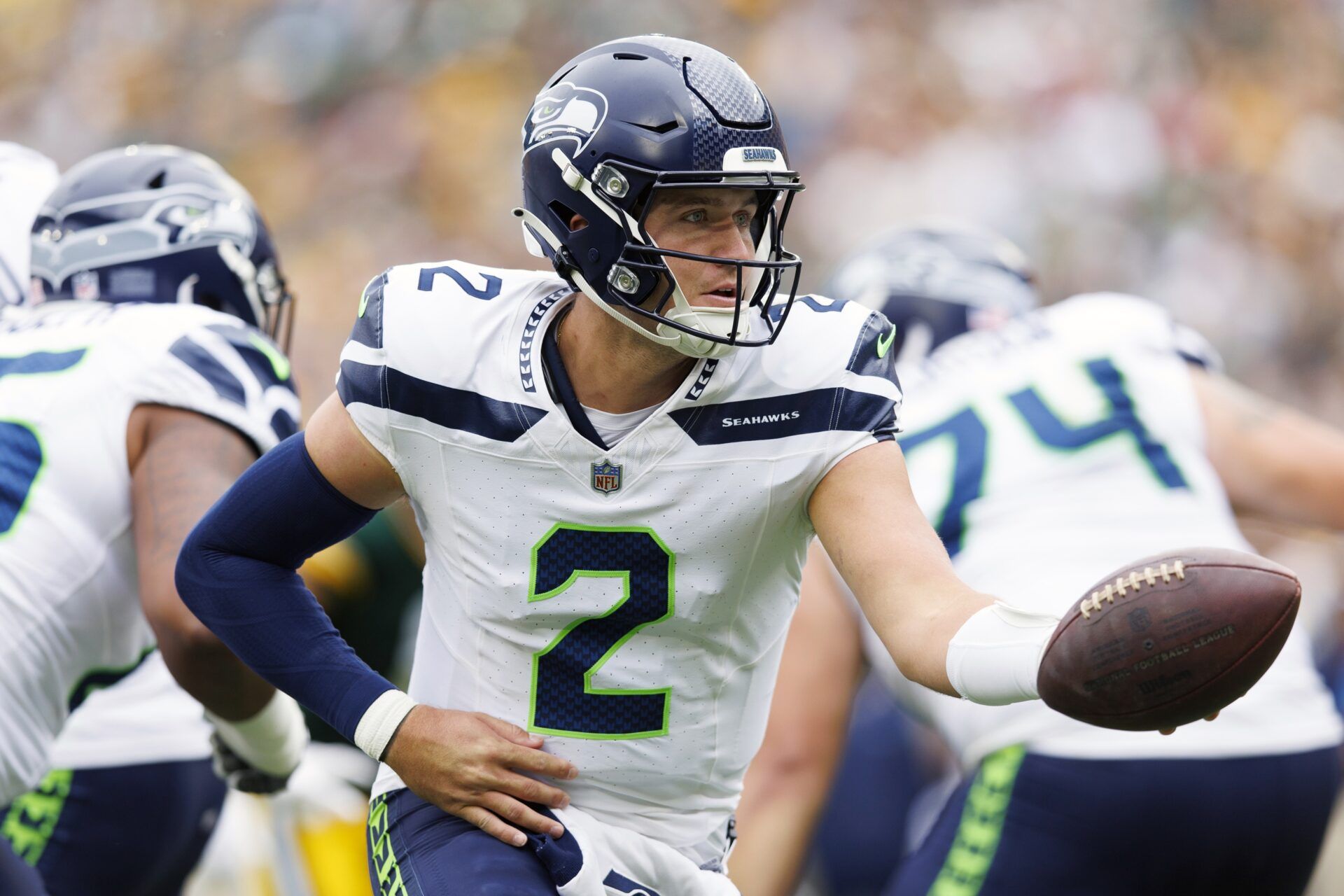 Seattle Seahawks QB Drew Lock (2) looks to hand the ball off.