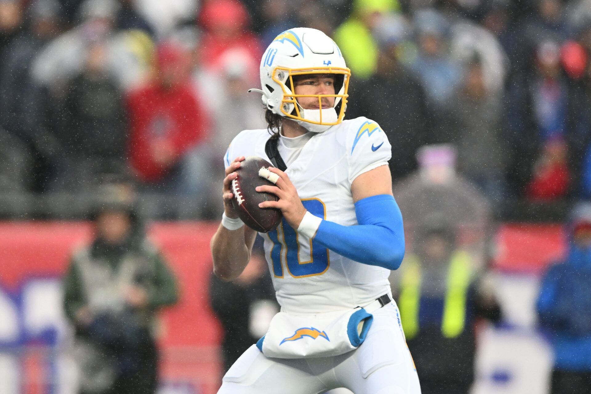 Los Angeles Chargers quarterback Justin Herbert (10) looks to throw against the New England Patriots during the first half at Gillette Stadium.