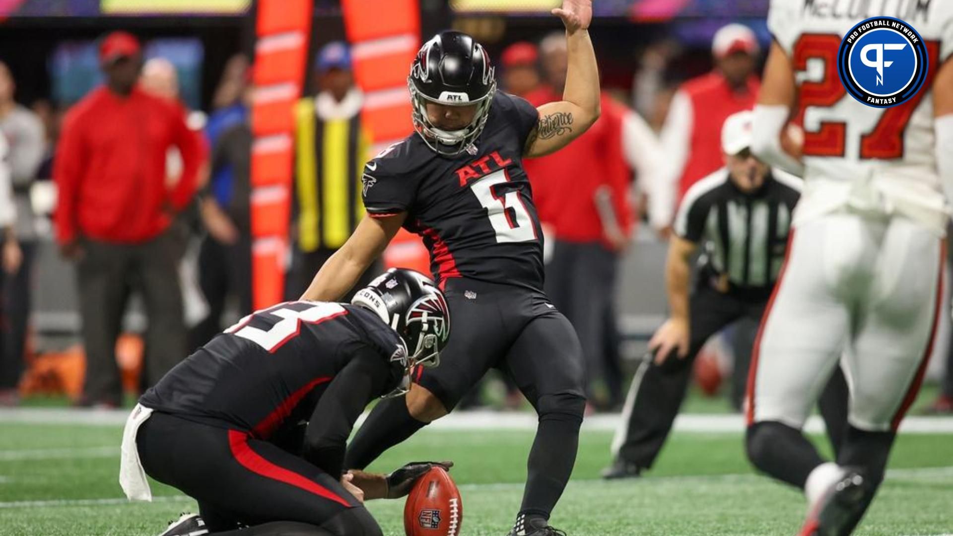 Atlanta Falcons place kicker Younghoe Koo (6) kicks a field goal against the Tampa Bay Buccaneers in the first half at Mercedes-Benz Stadium.