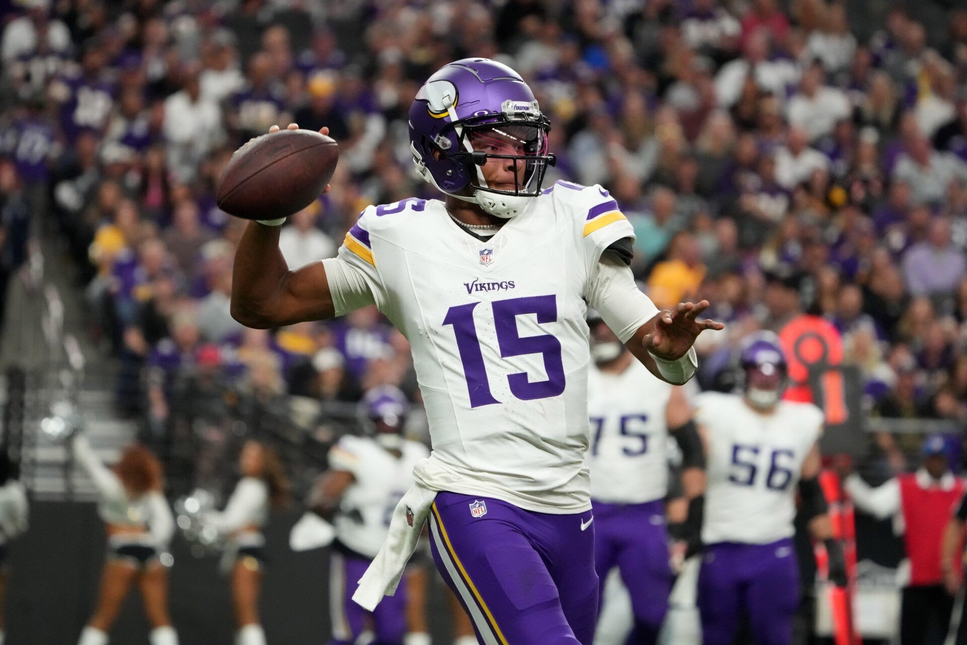 Minnesota Vikings quarterback Joshua Dobbs (15) throws the ball against the Las Vegas Raiders in the first half at Allegiant Stadium.