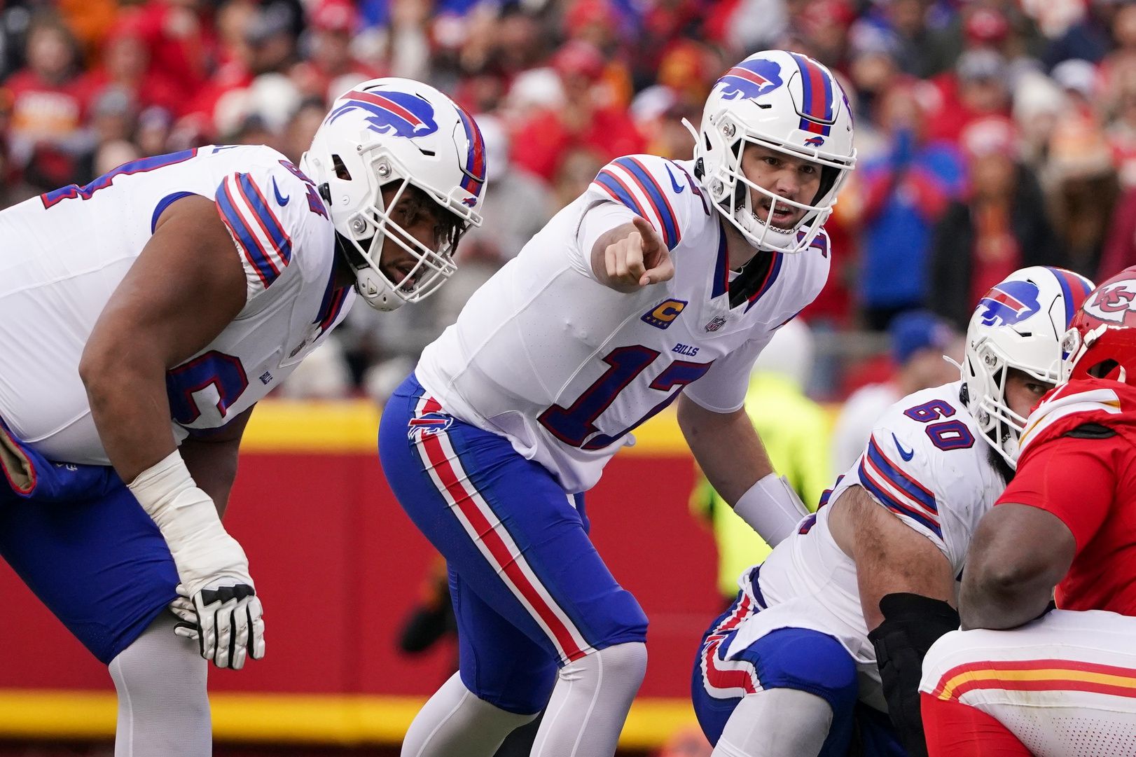 Buffalo Bills quarterback Josh Allen (17) gestures at the line of scrimmage against the Kansas City Chiefs during the first half at GEHA Field at Arrowhead Stadium.