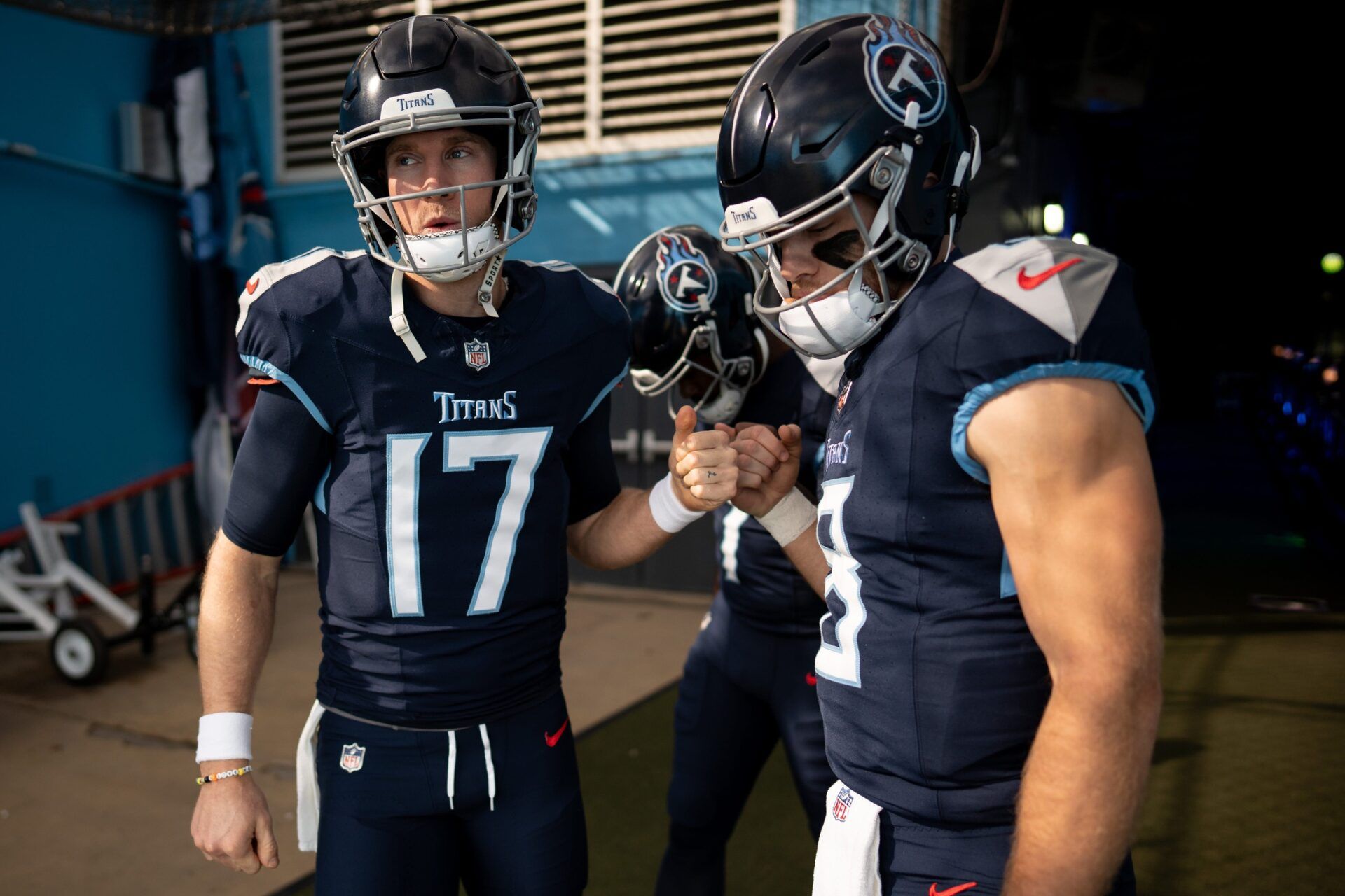 Ryan Tannehill (17), quarterback Malik Willis (7), and quarterback Will Levis (8) huddle before a game against the Indianapolis Colts at Nissan Stadium.