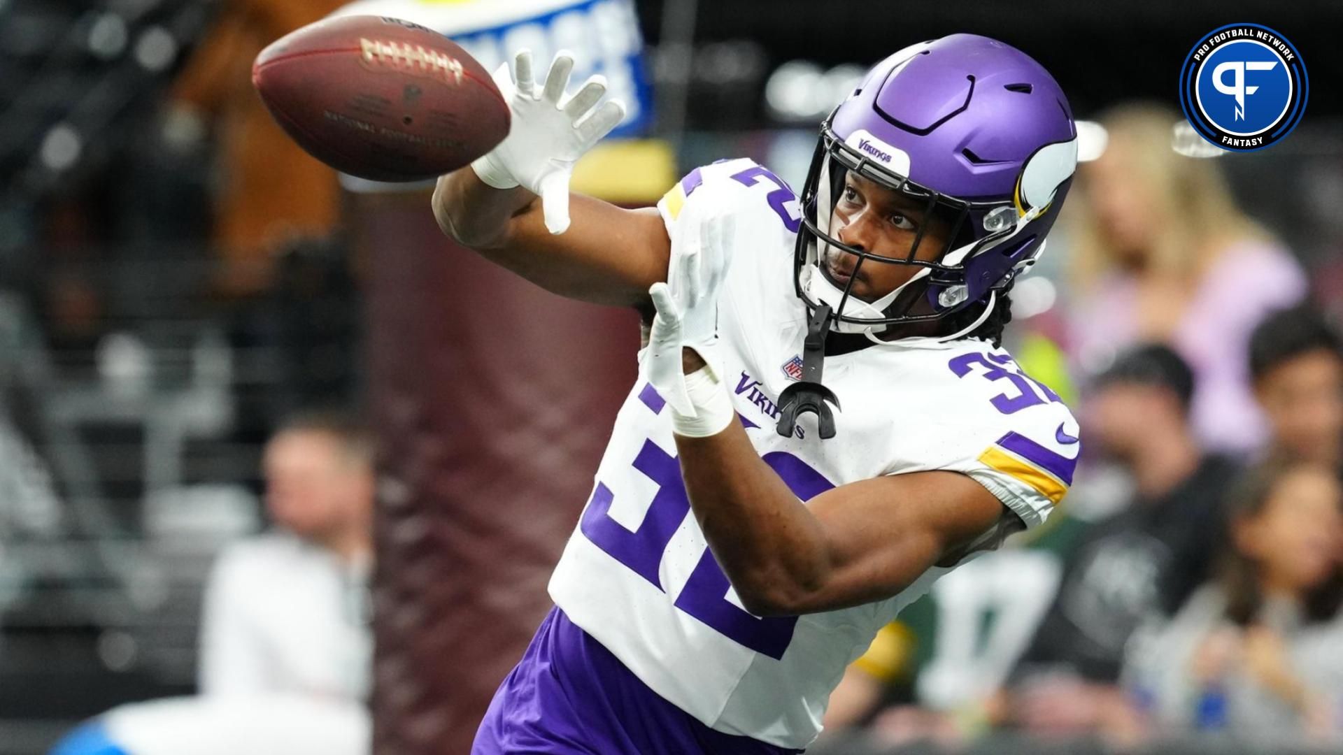 Minnesota Vikings running back Ty Chandler (32) warms up before a game against the Las Vegas Raiders at Allegiant Stadium.