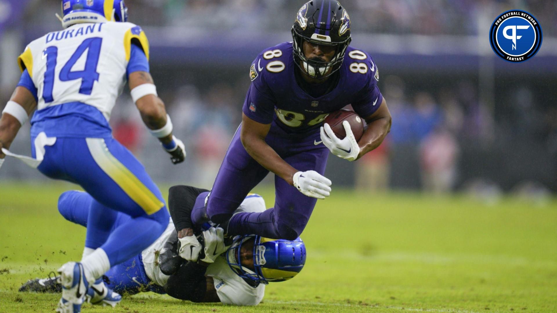 Baltimore Ravens tight end Isaiah Likely (80) is tackled by Los Angeles Rams safety John Johnson III (43) during the second quarter at M&T Bank Stadium.