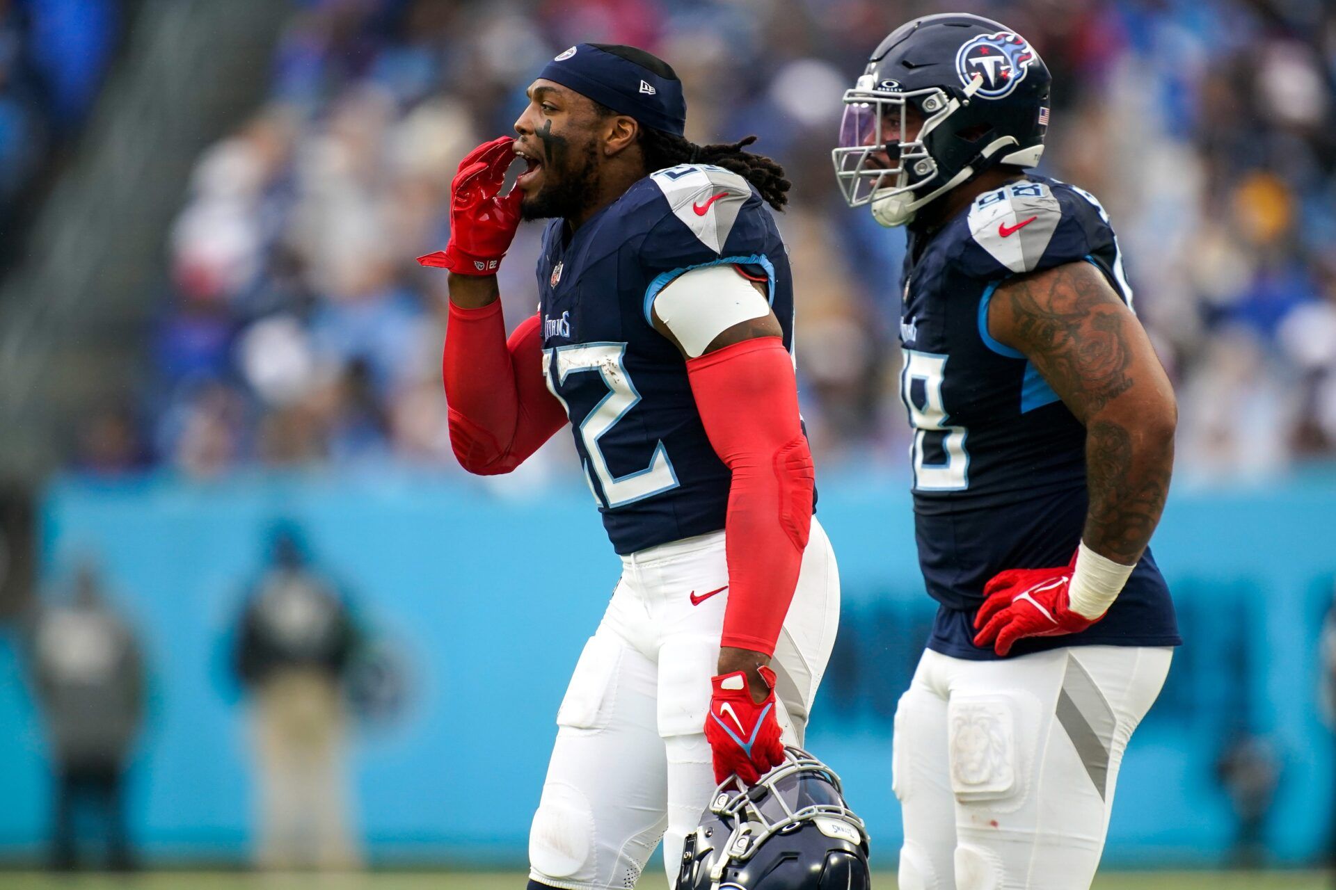 Tennessee Titans running back Derrick Henry (22) and defensive tackle Jeffery Simmons (98) on the sidelines during the second quarter against the Carolina Panthers at Nissan Stadium in Nashville, Tenn., Sunday, Nov. 26, 2023.