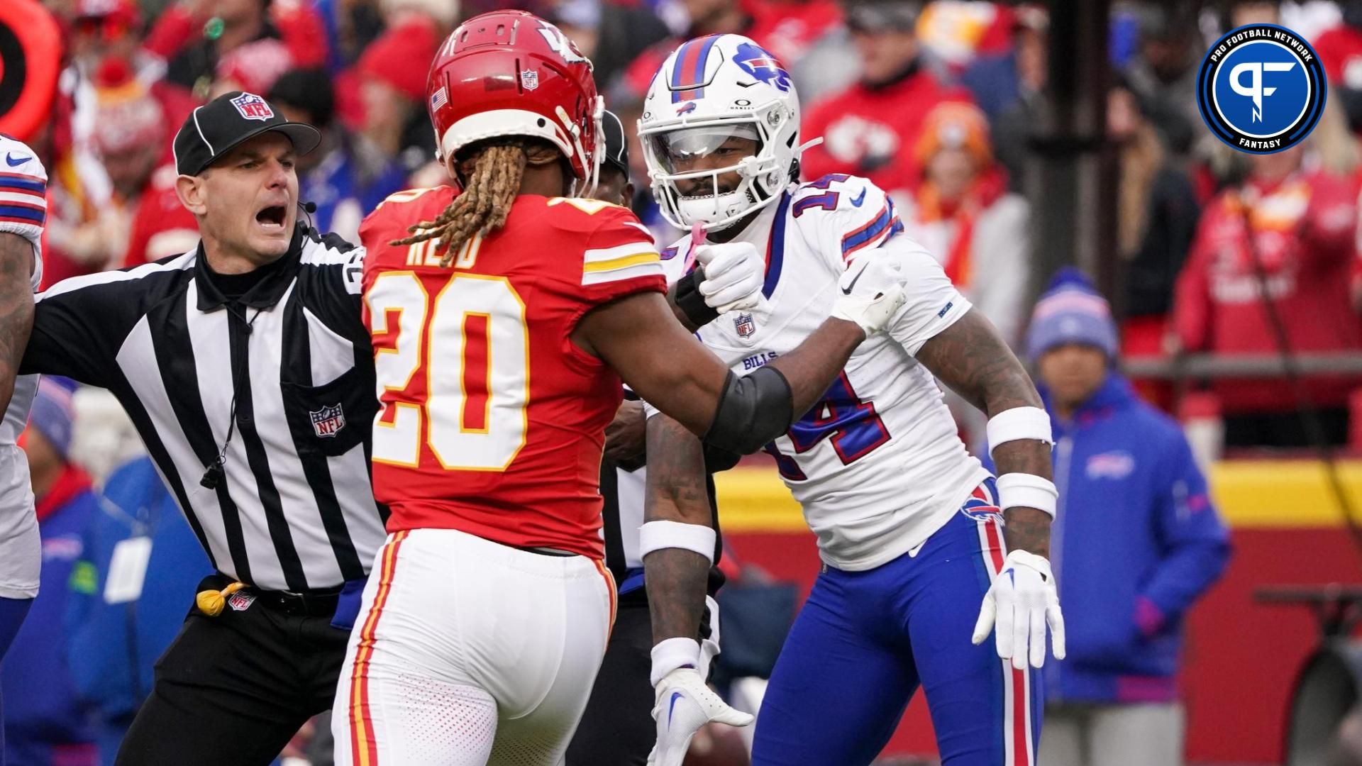 Kansas City Chiefs safety Justin Reid (20) and Buffalo Bills wide receiver Stefon Diggs (14) scuffle after a play during the first half at GEHA Field at Arrowhead Stadium.