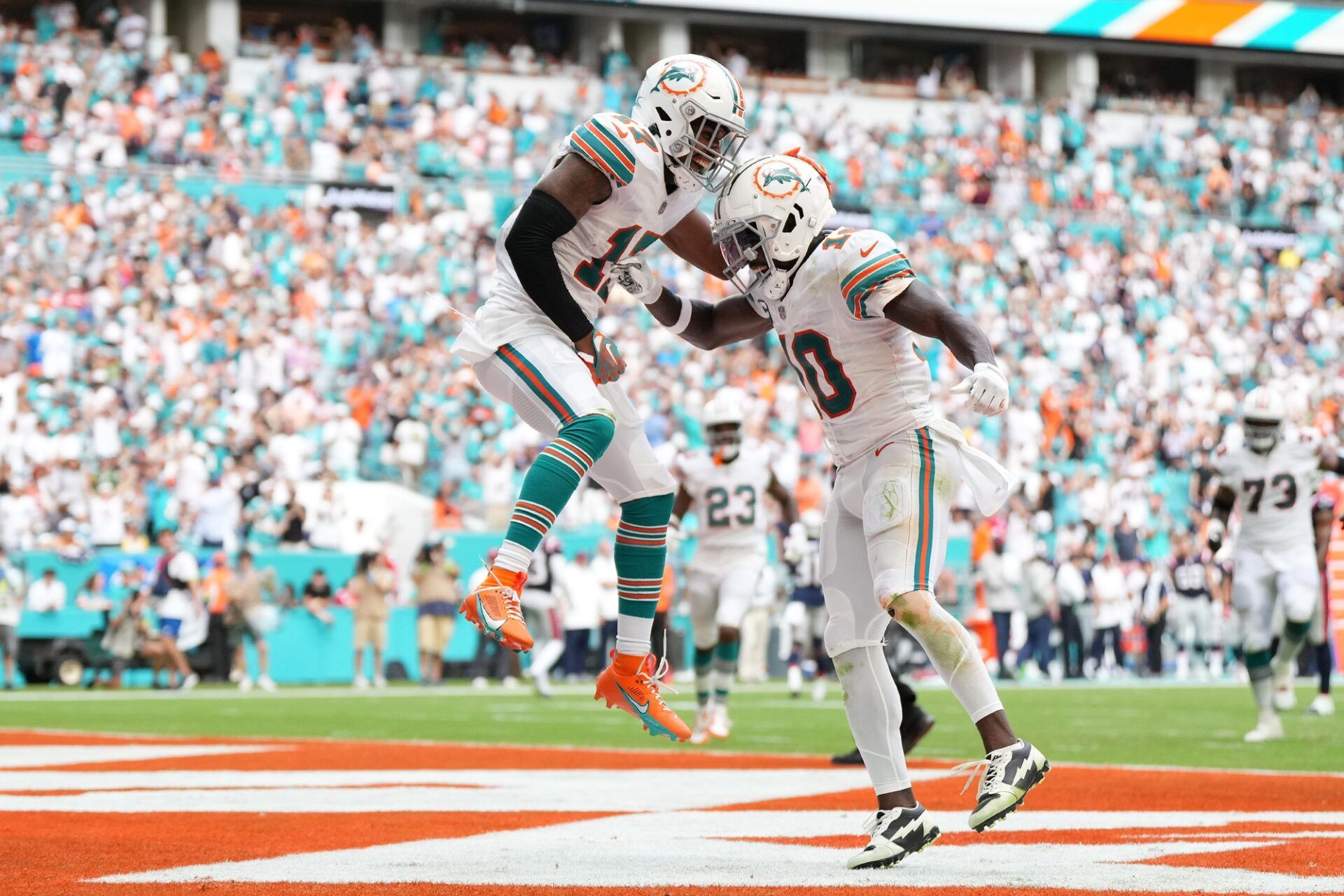 Miami Dolphins wide receiver Jaylen Waddle (17) celebrates his touchdown against the New England Patriots with wide receiver Tyreek Hill (10) during the second half at Hard Rock Stadium.