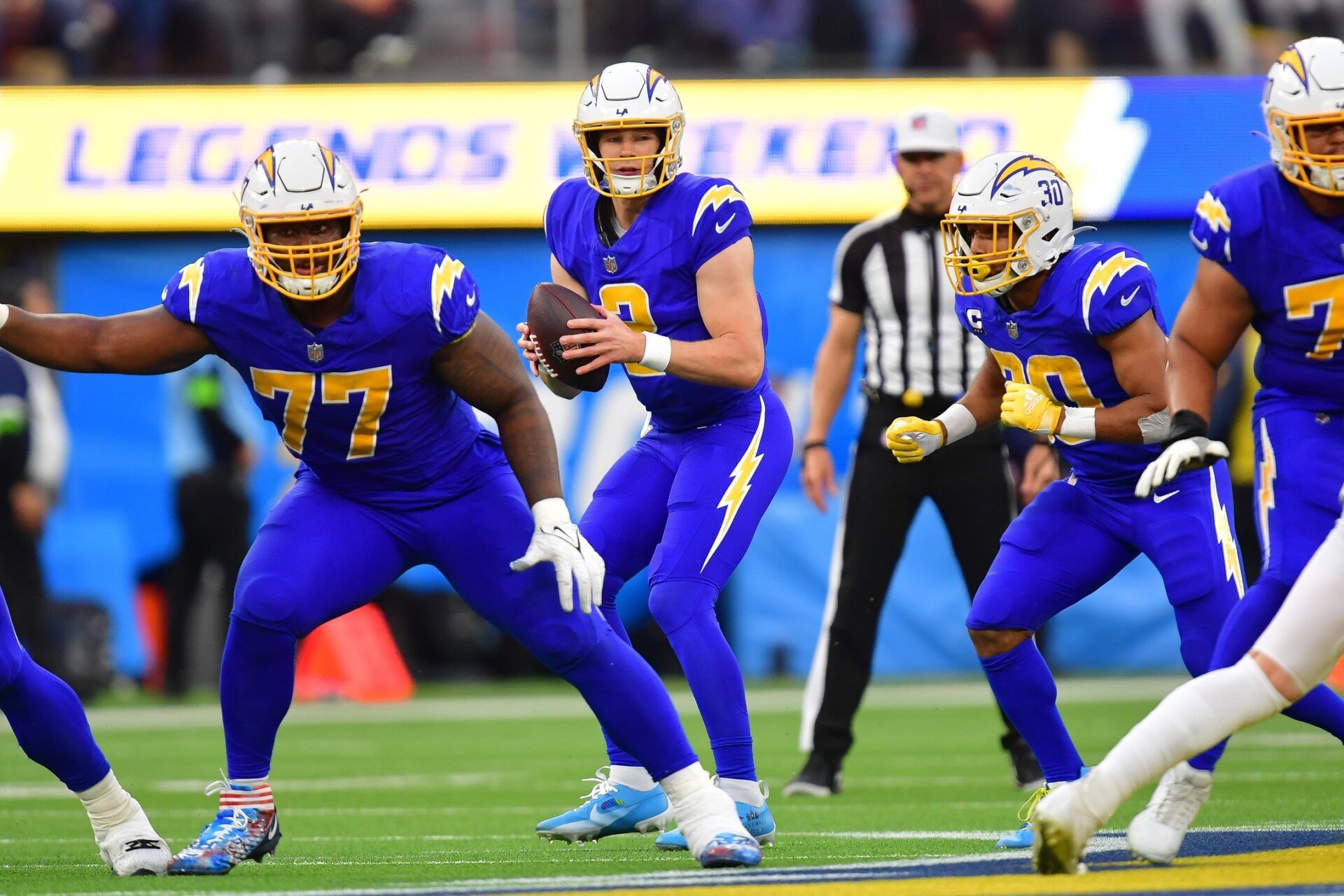 Los Angeles Chargers quarterback Easton Stick (2) drops back to pass against the Denver Broncos during the second half at SoFi Stadium.