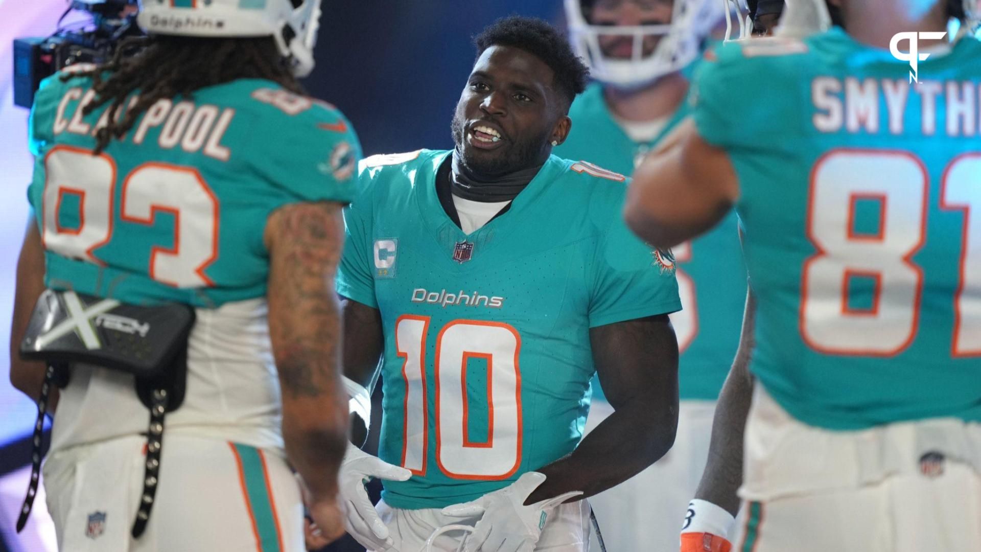 Miami Dolphins wide receiver Tyreek Hill (10) prepares to enter the field for warm-ups before the start of a NFL football game against the Tennessee Titans at Hard Rock Stadium in Miami Gardens, Dec. ...