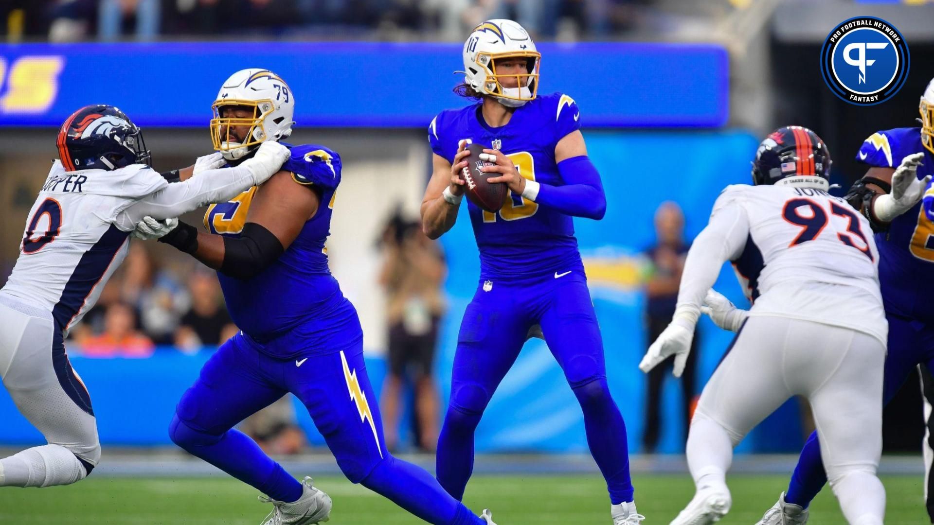 Los Angeles Chargers quarterback Justin Herbert (10) drops back to pass against the Denver Broncos during the first half at SoFi Stadium.