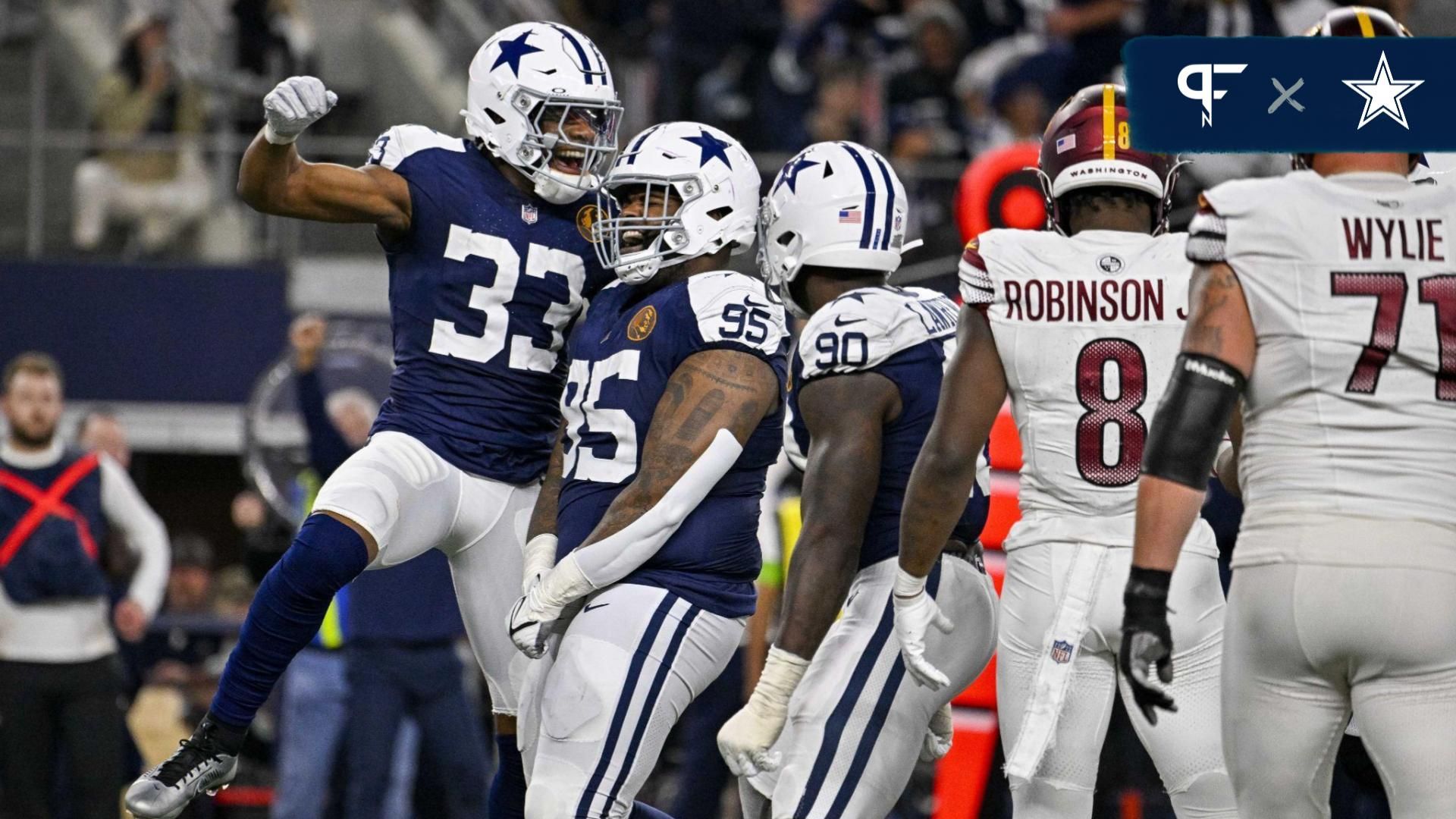 Dallas Cowboys linebacker Damone Clark (33) and defensive tackle Johnathan Hankins (95) and defensive end DeMarcus Lawrence (90) celebrates after the Cowboys make a stop on the Washington Commanders on fourth down to turn the ball over on downs during the second half at AT&T Stadium.