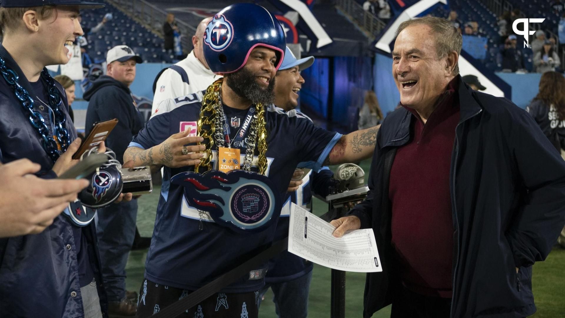 Tennessee Titans fans laugh with NFL commentator Al Michaels before the game between the Tennessee Titans and the Dallas Cowboys at Nissan Stadium.