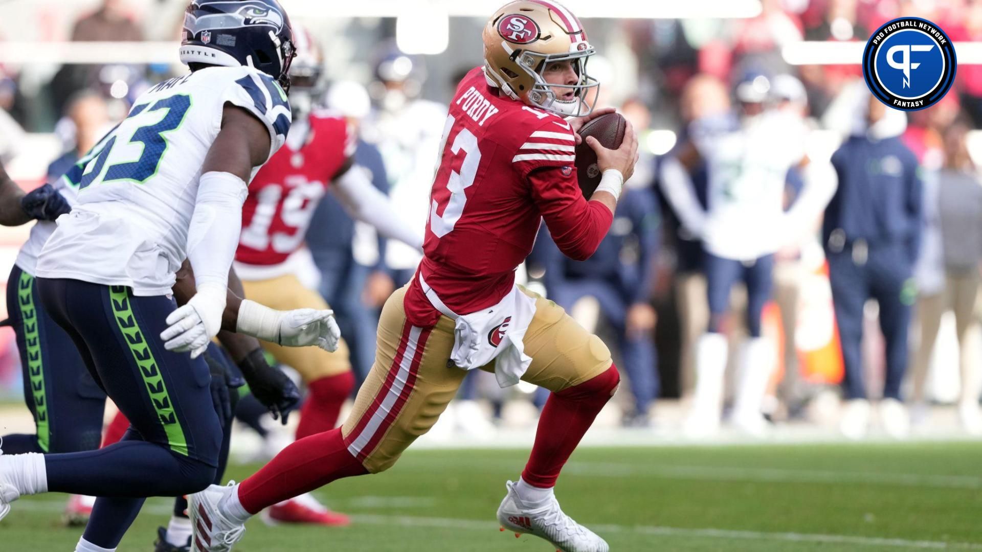 San Francisco 49ers QB Brock Purdy (13) scrambles against the Seattle Seahawks.