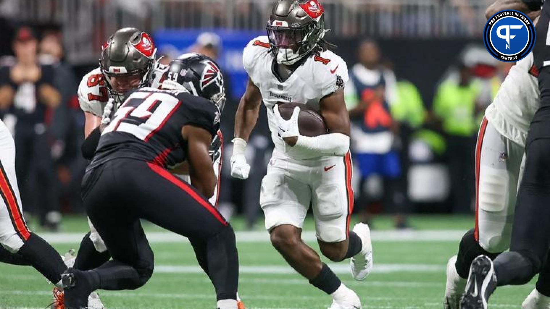 Tampa Bay Buccaneers running back Rachaad White (1) runs the ball against the Atlanta Falcons in the second half at Mercedes-Benz Stadium.