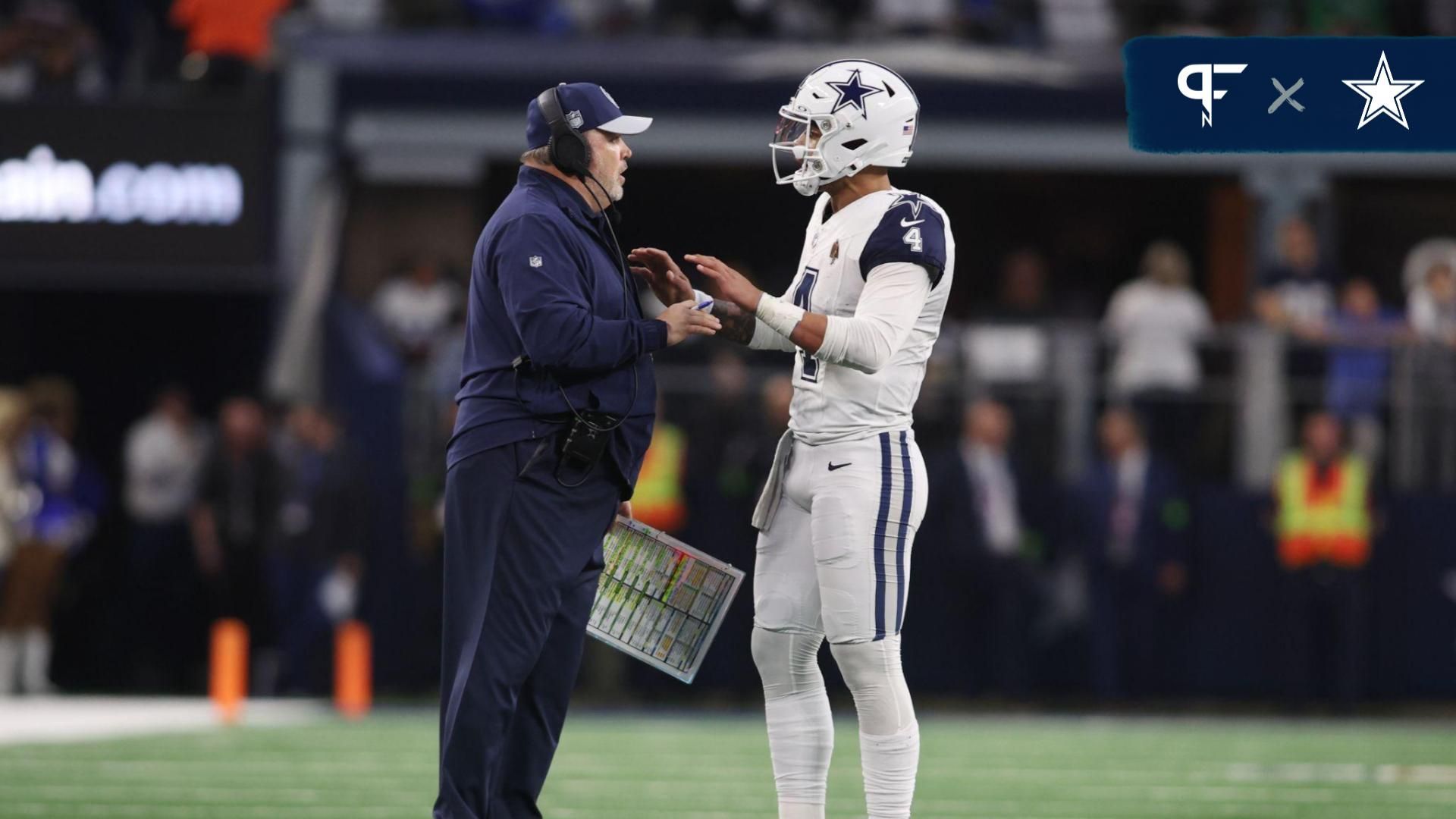 Dallas Cowboys head coach Mike McCarthy talks with quarterback Dak Prescott (4) during a timeout in the game against the Philadelphia Eagles at AT&T Stadium.