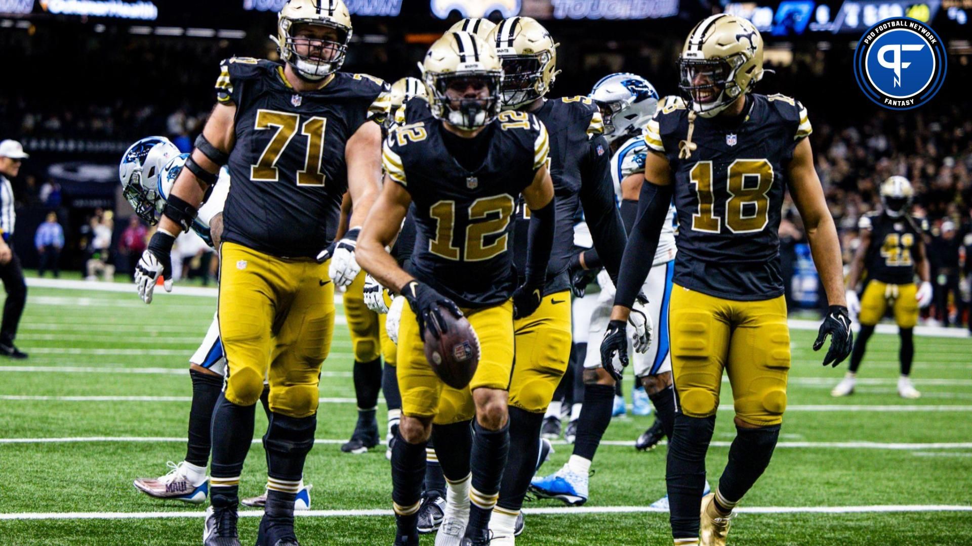 New Orleans Saints wide receiver Chris Olave (12) reacts to making a touchdown against Carolina Panthers safety Vonn Bell (24) during the second half at the Caesars Superdome.