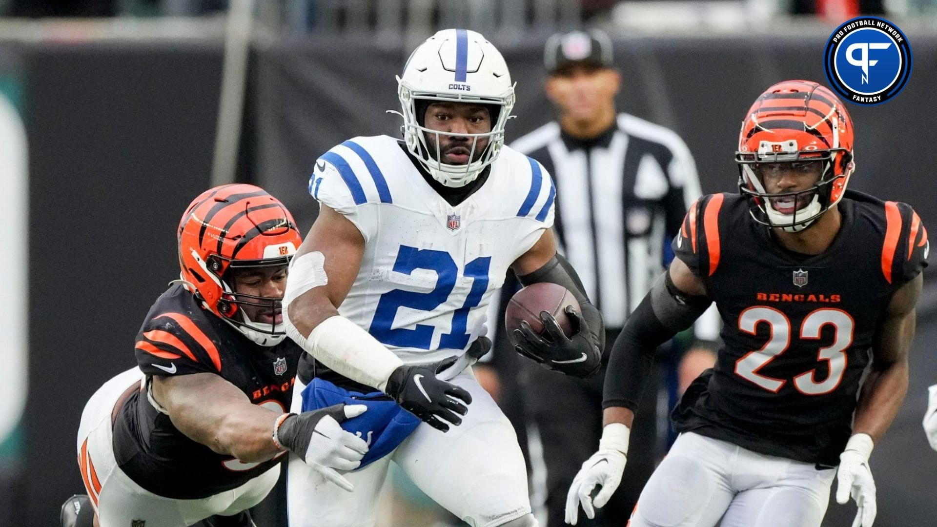 Cincinnati Bengals defensive tackle BJ Hill (92) dives to bring down Indianapolis Colts running back Zack Moss