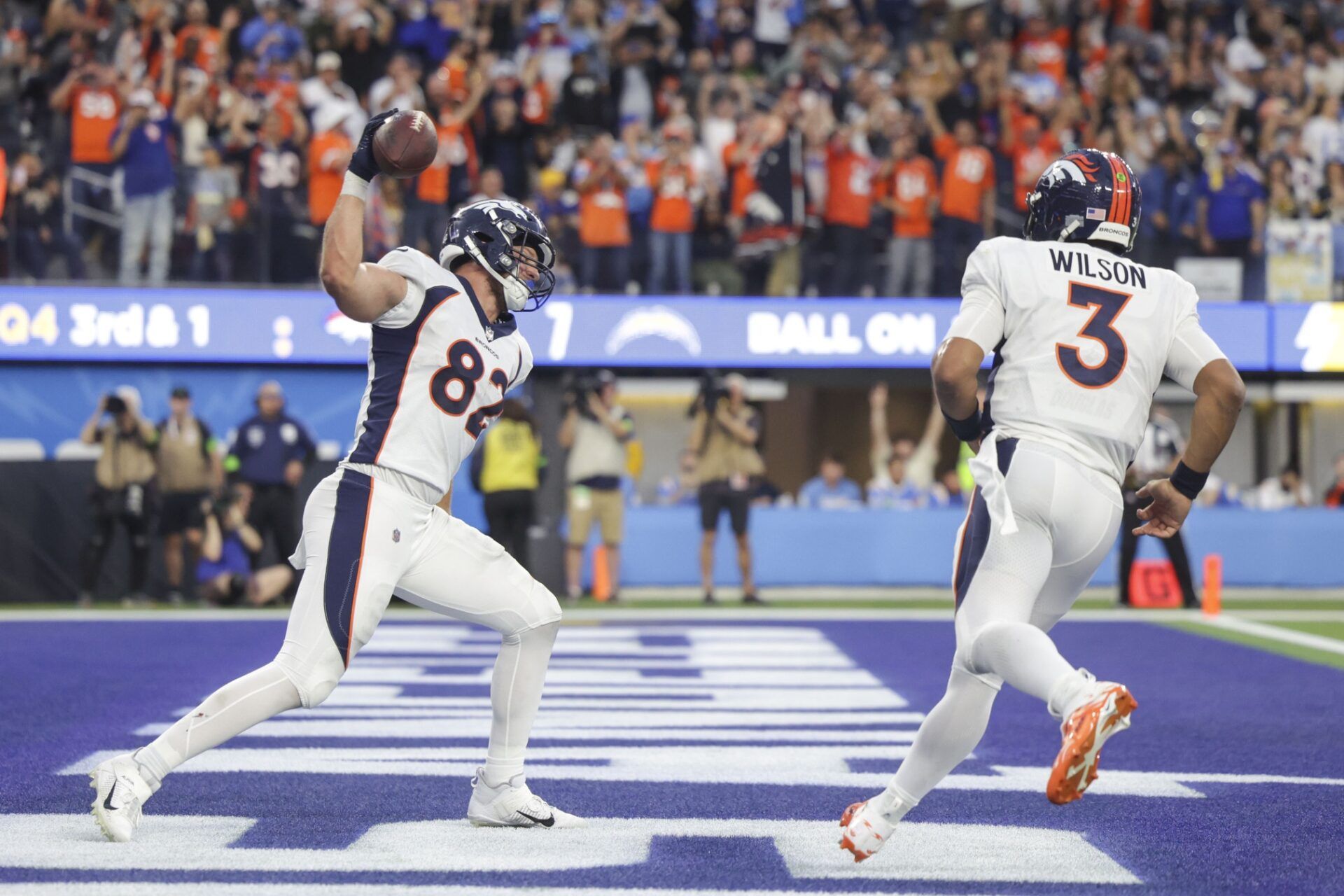 Denver Broncos TE Adam Trautman (82) celebrates with QB Russell Wilson (3) after scoring a touchdown.