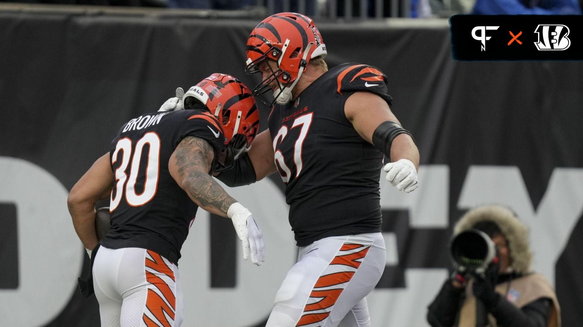 Cincinnati Bengals running back Chase Brown (30) celebrates with Cincinnati Bengals guard Cordell Volson (67) after scoring a touchdown at Paycor Stadium.