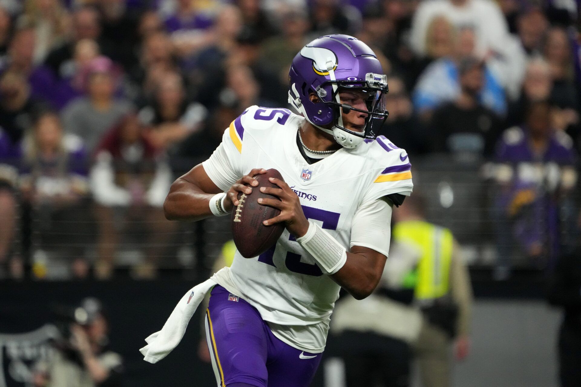 Minnesota Vikings quarterback Joshua Dobbs (15) throws the ball against the Las Vegas Raiders in the first half at Allegiant Stadium.