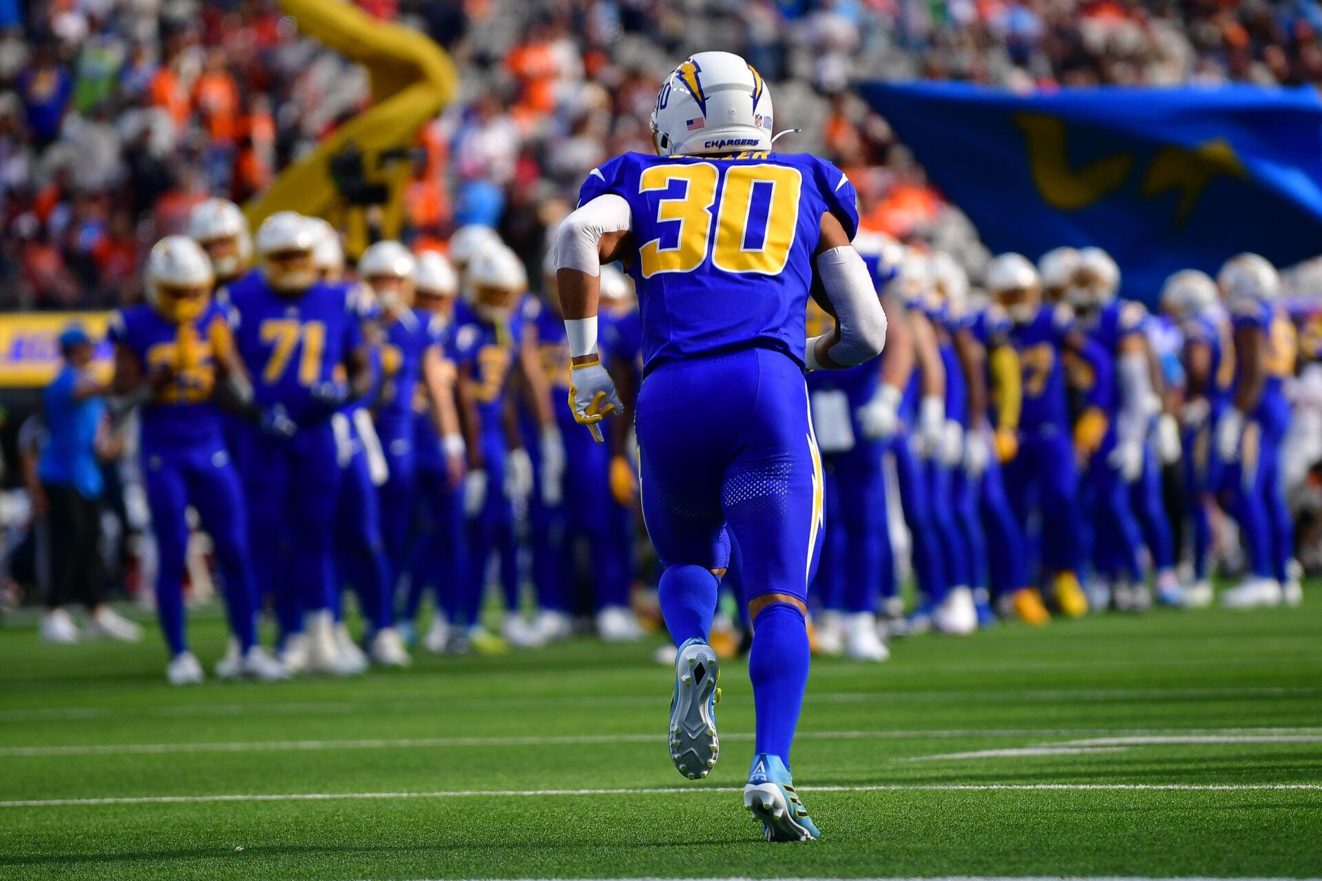 Los Angeles Chargers running back Austin Ekeler (30) is introduced before playing against the Denver Broncos at SoFi Stadium.