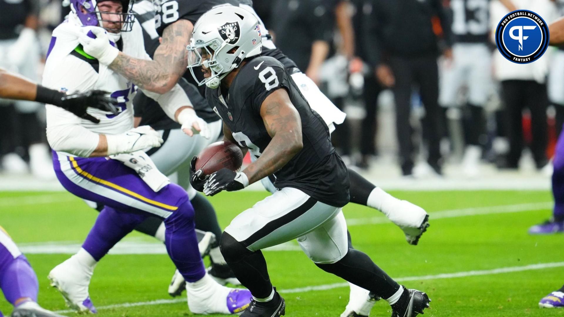 Las Vegas Raiders running back Josh Jacobs (8) rushes against the Minnesota Vikings during the first quarter at Allegiant Stadium.