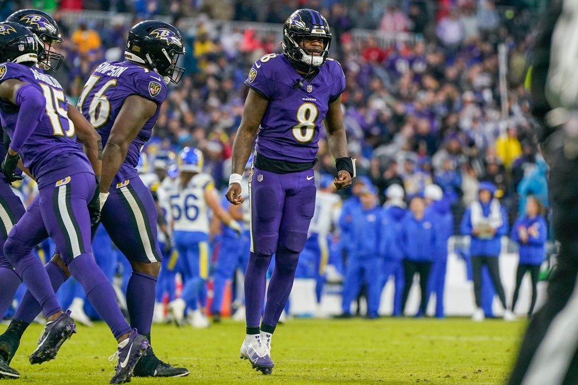 Baltimore Ravens quarterback Lamar Jackson (8) celebrates after the team scores a touchdown against the Los Angeles Rams during the fourth quarter at M&T Bank Stadium.