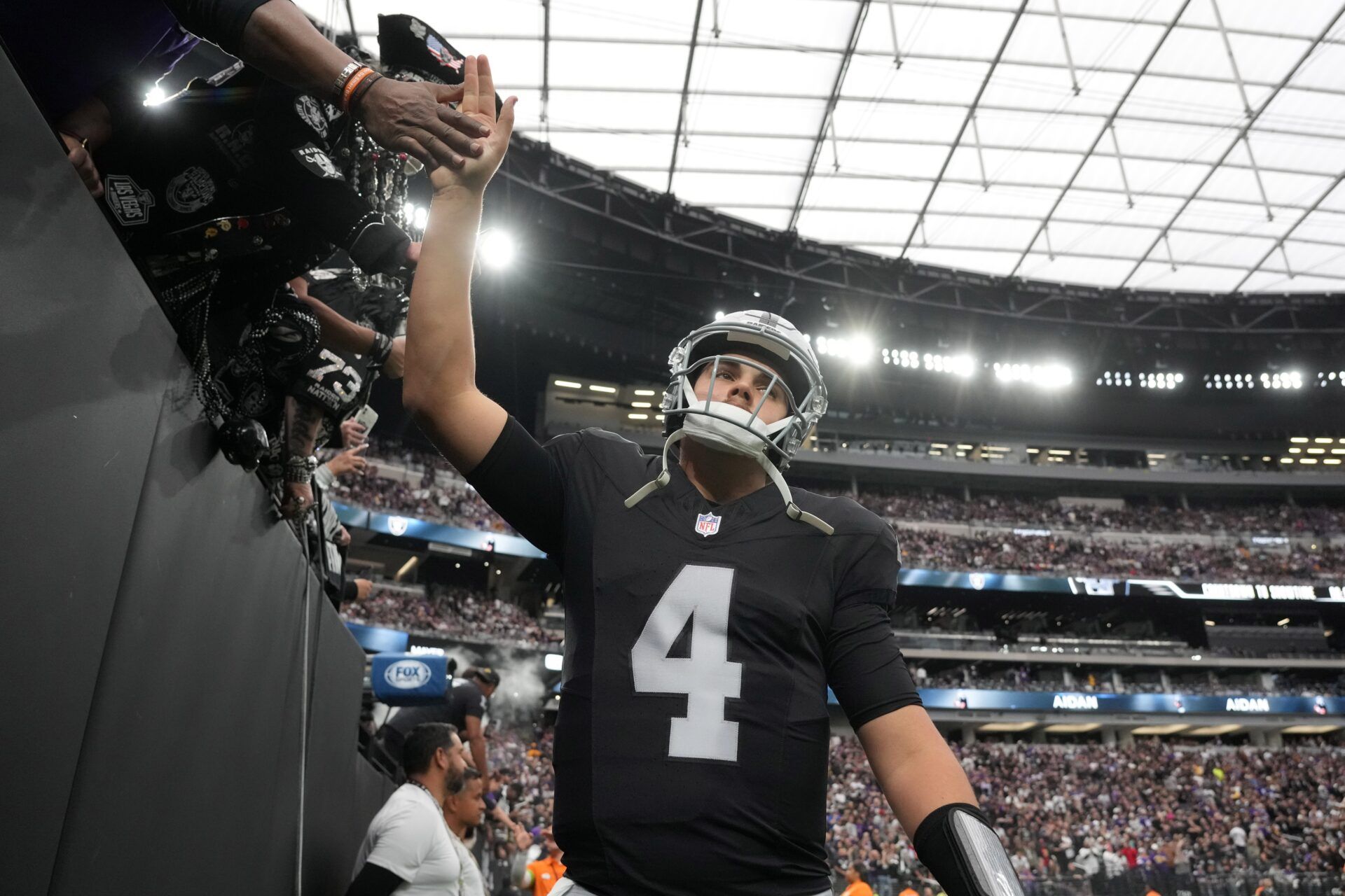 Las Vegas Raiders quarterback Aidan O'Connell (4) is greeted by fans during the game against the Minnesota Vikings at Allegiant Stadium.