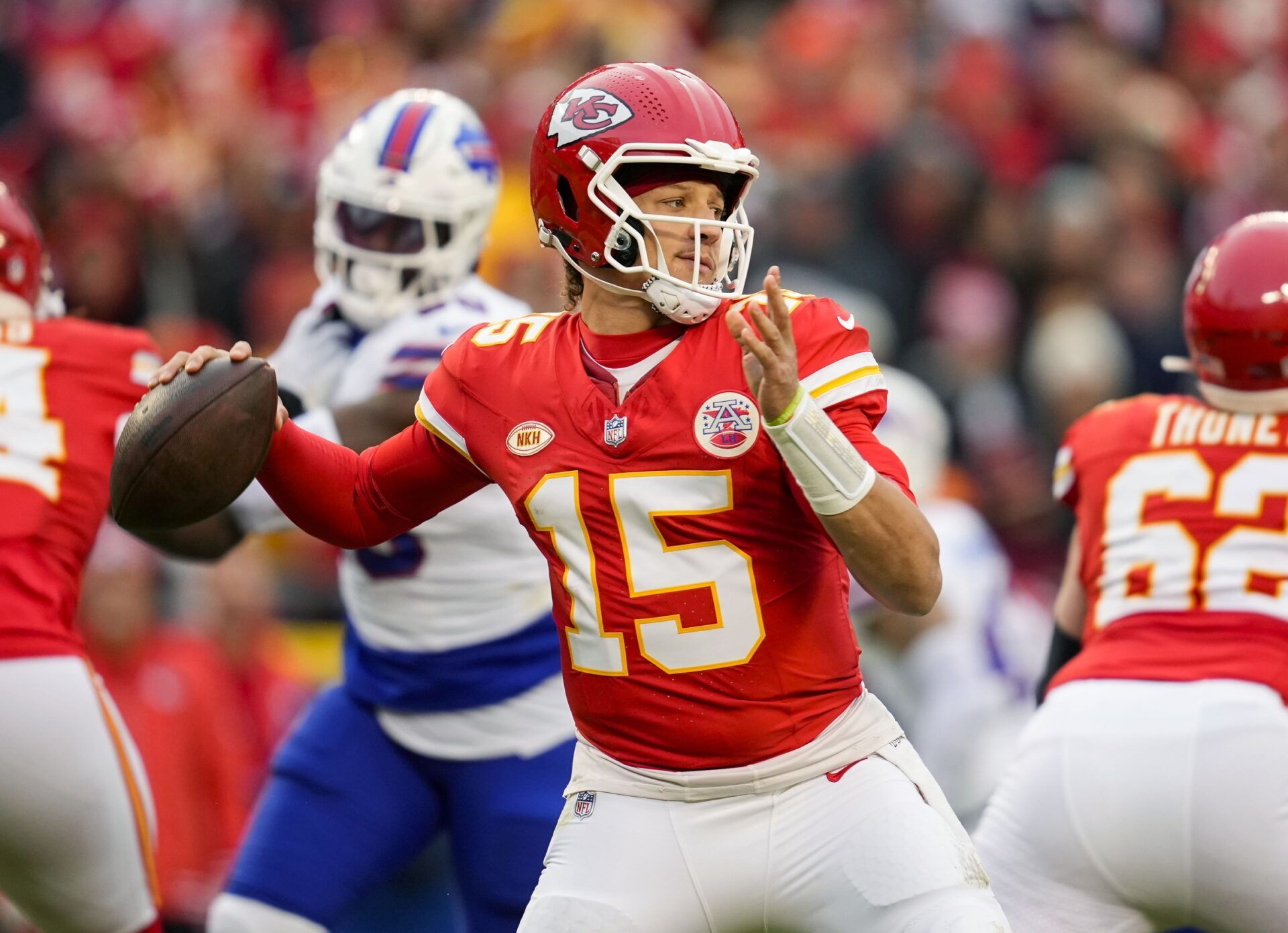 Kansas City Chiefs quarterback Patrick Mahomes (15) throws a pass against the Buffalo Bills during the first half at GEHA Field at Arrowhead Stadium.