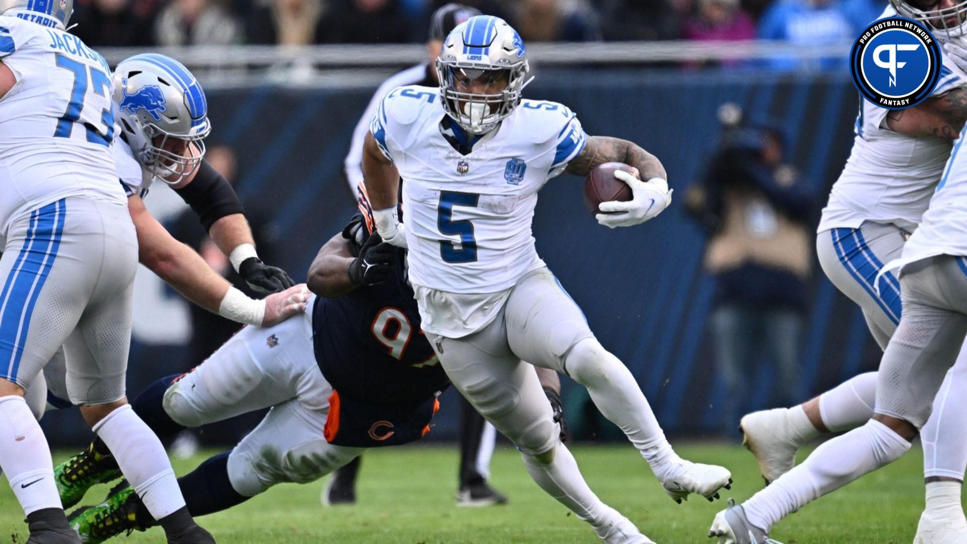 Detroit Lions running back David Montgomery (5) picks up yardage in the first half against the Chicago Bears at Soldier Field.