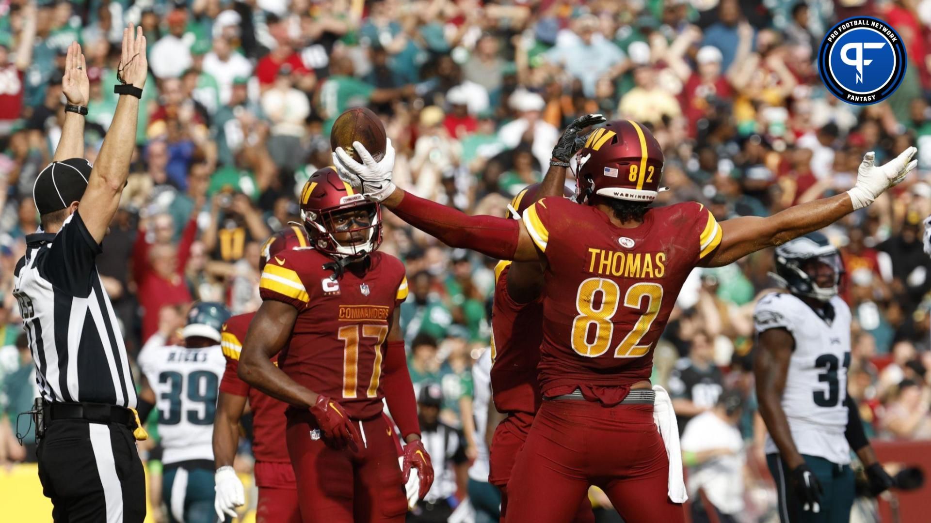 Washington Commanders tight end Logan Thomas (82) celebrates with teammates after scoring a touchdown against the Philadelphia Eagles during the fourth quarter at FedExField.