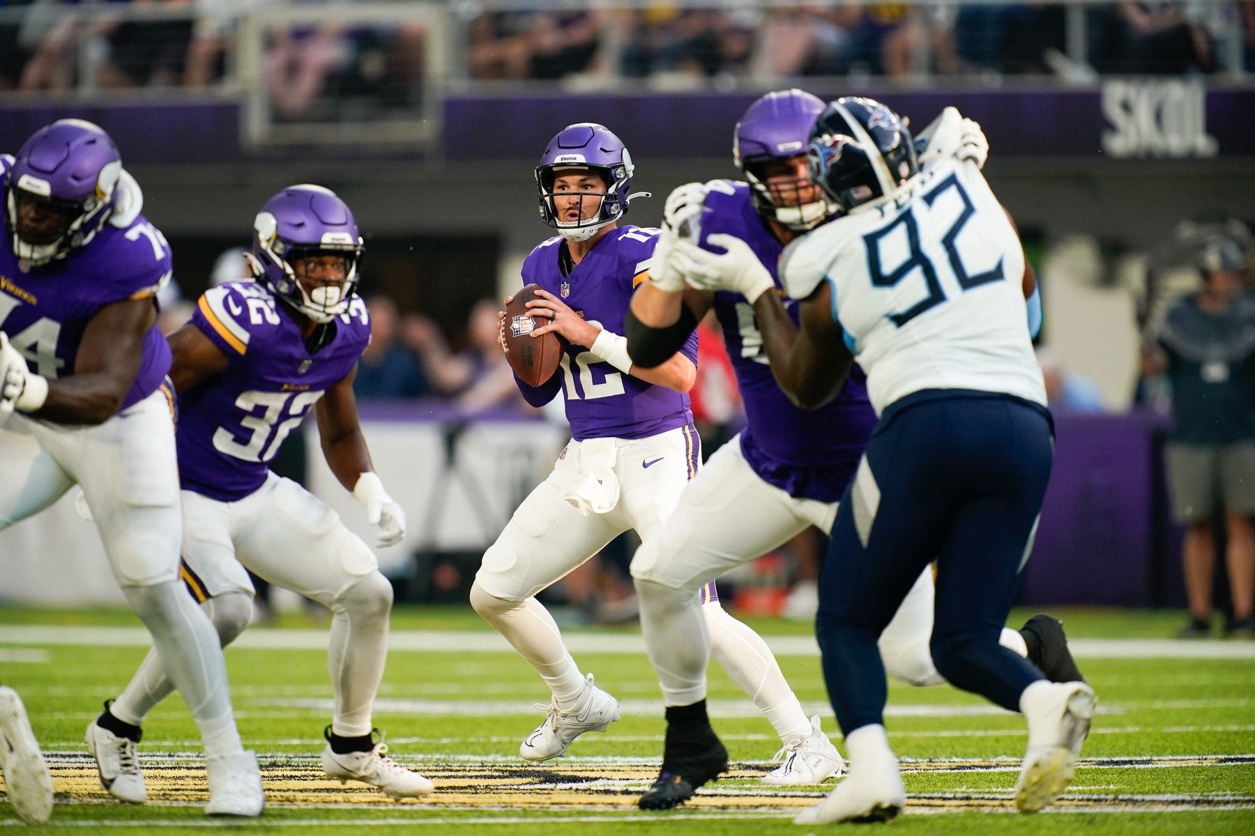 Minnesota Vikings quarterback Nick Mullens (12) looks for a receiver at U.S. Bank Stadium.