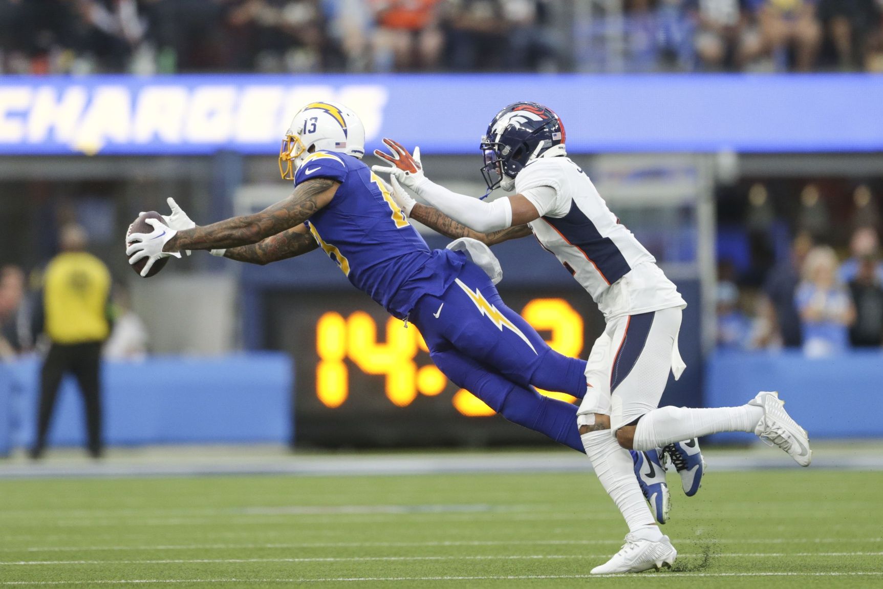 Los Angeles Chargers wide receiver Keenan Allen (13) catches the ball during the second half in a game against the Denver Broncos at SoFi Stadium.