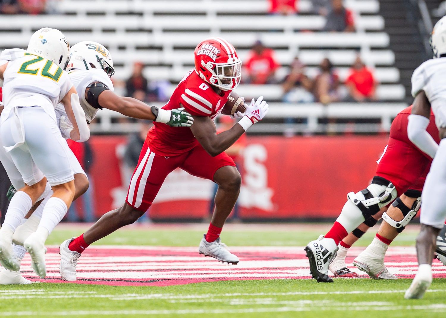 Jacob Kibodi runs the ball as the Louisiana’s Ragin Cajuns take on Southeastern Louisiana Football at Cajun Field.