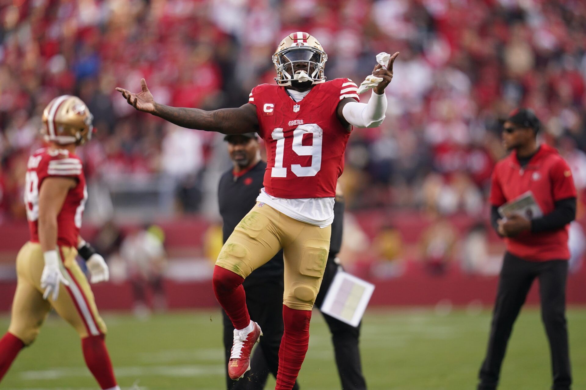 San Francisco 49ers WR Deebo Samuel (19) jumps in celebration against the Seattle Seahawks.