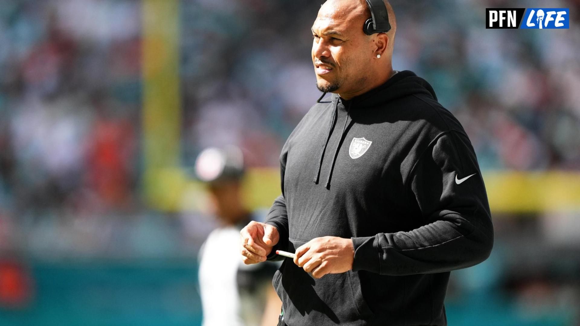 Las Vegas Raiders head coach Antonio Pierce stands on the field during the first half against the Miami Dolphins at Hard Rock Stadium.