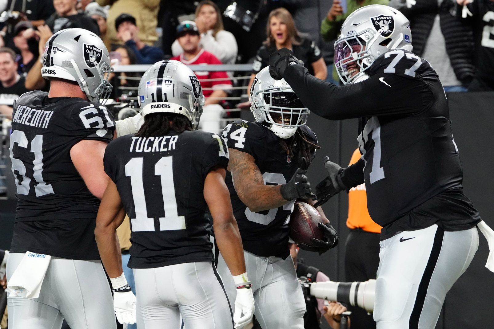 Las Vegas Raiders celebrate after a touchdown against the Los Angeles Chargers.