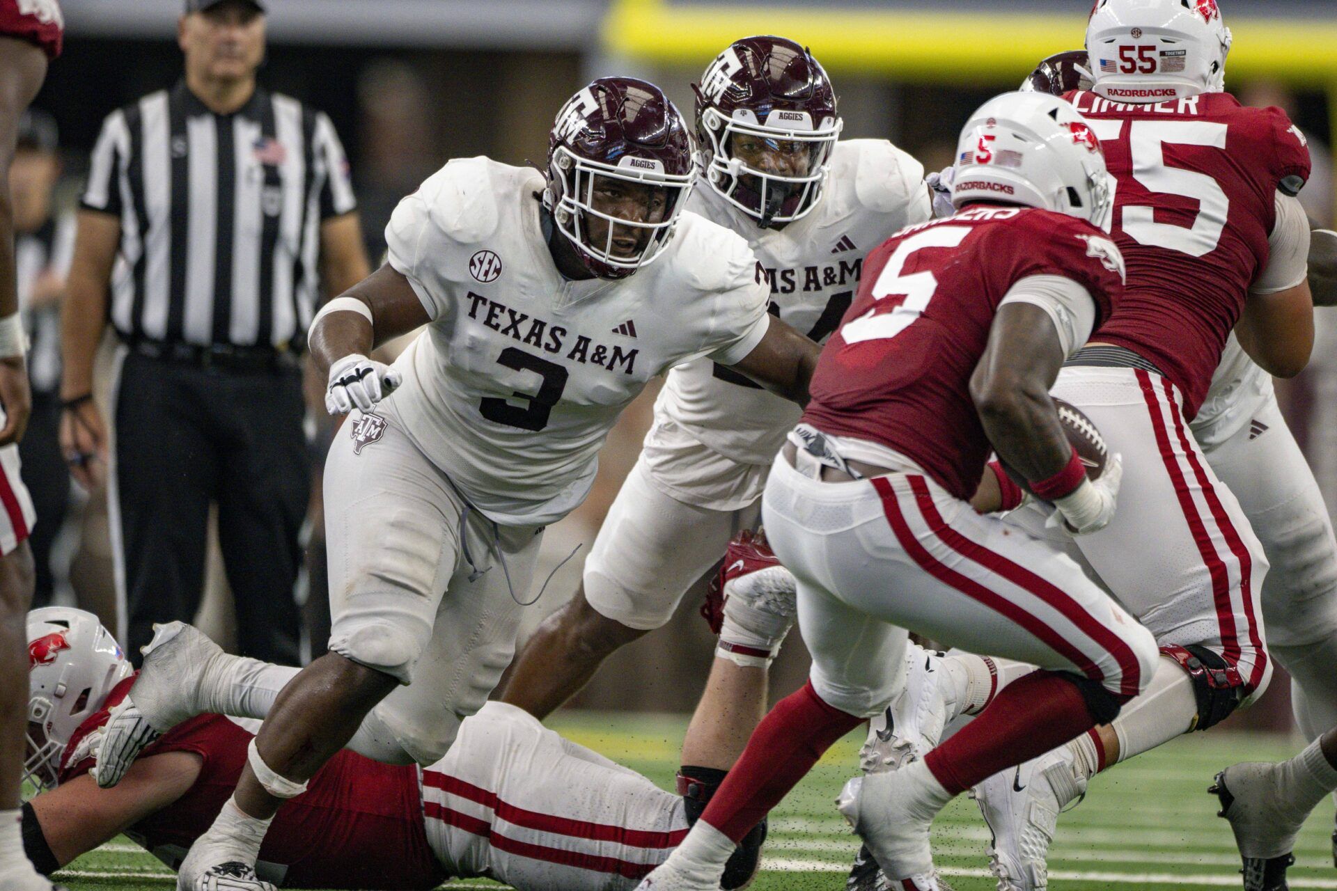 Texas A&M Aggies defensive lineman McKinnley Jackson (3) and Arkansas Razorbacks running back Raheim Sanders (5) in action during the game between the Texas A&M Aggies and the Arkansas Razorbacks at AT&T Stadium.