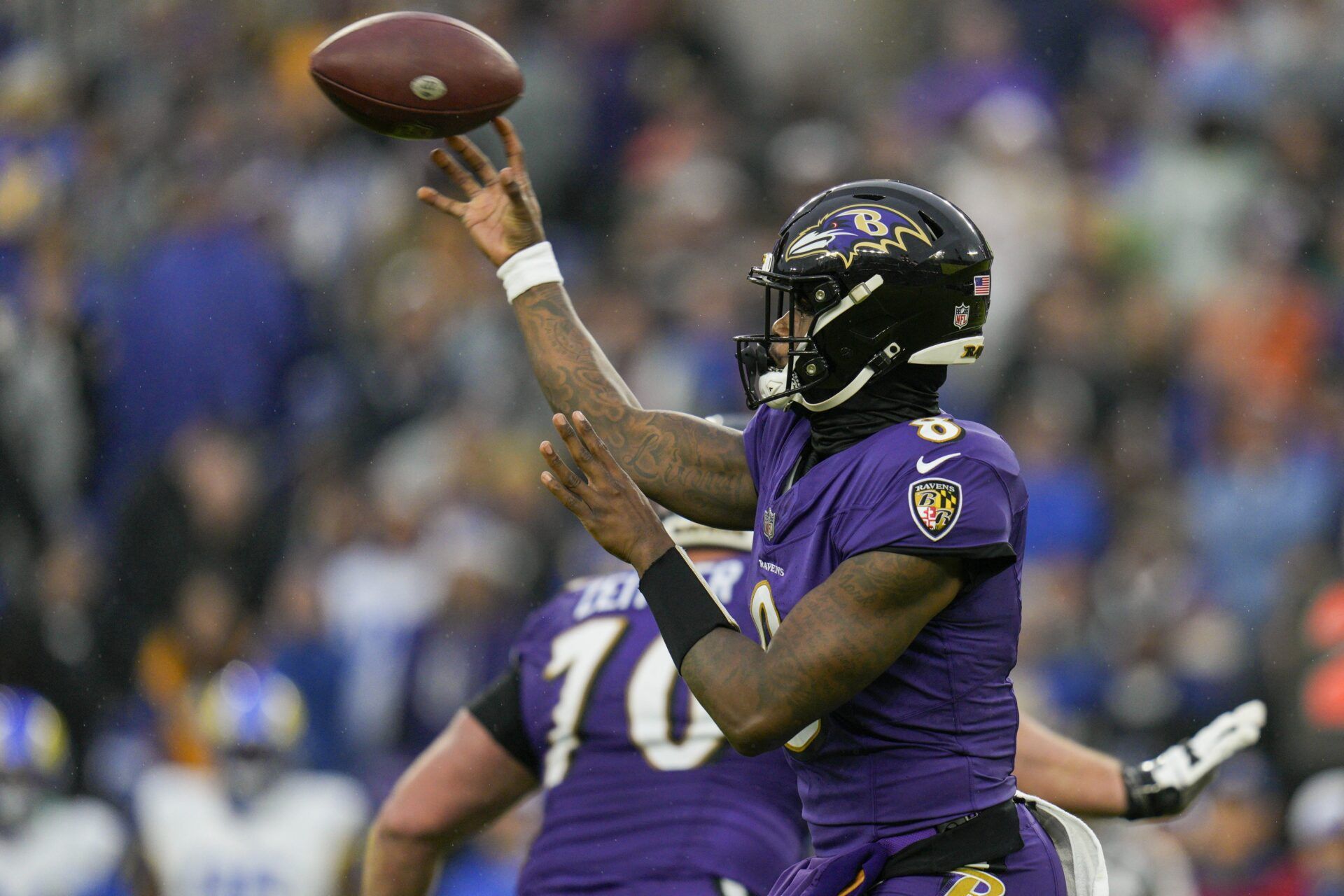 Baltimore Ravens quarterback Lamar Jackson (8) passes against the Los Angeles Rams during the second quarter at M&T Bank Stadium.