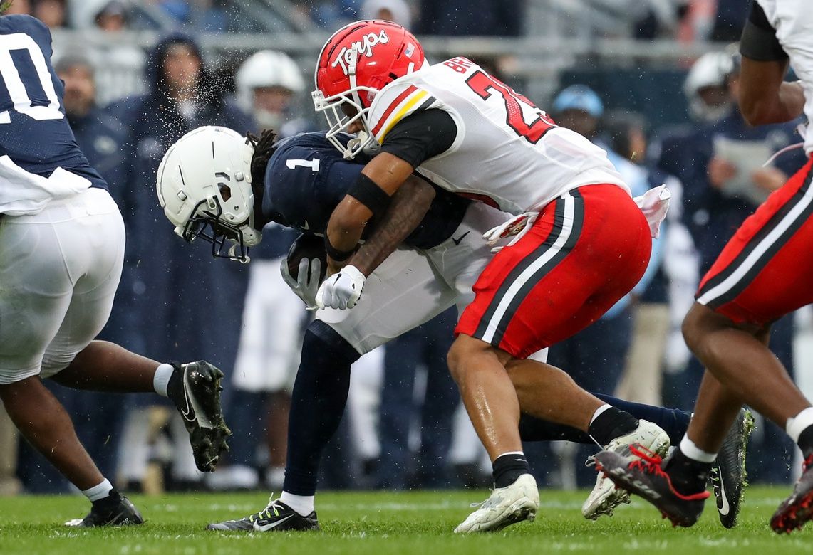 Penn State Nittany Lions wide receiver (1) runs with the ball while trying to avoid a tackle from Maryland Terrapins defensive back Beau Brade (25) during the first quarter at Beaver Stadium.