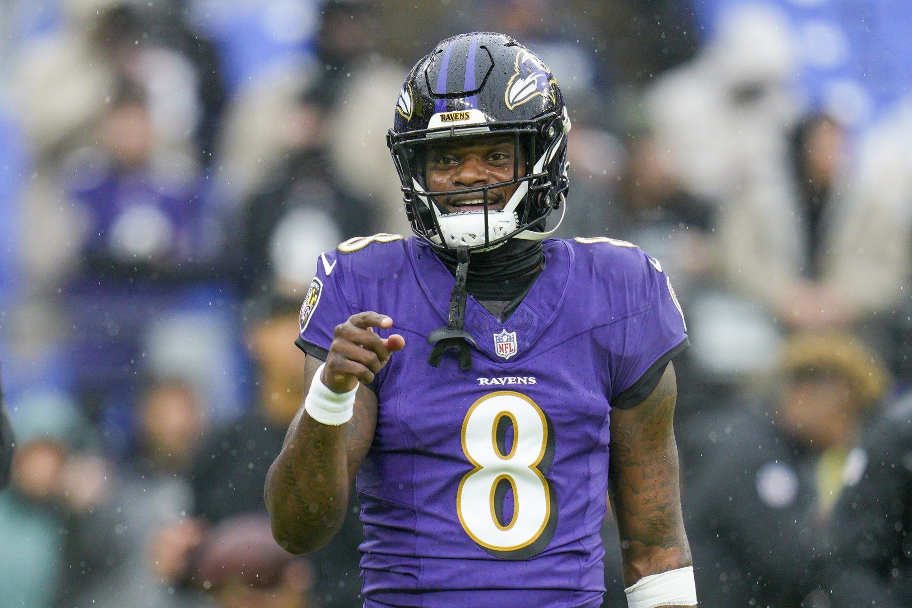 Baltimore Ravens quarterback Lamar Jackson (8) looks on during warmups before a game against the Los Angeles Rams at M&T Bank Stadium.