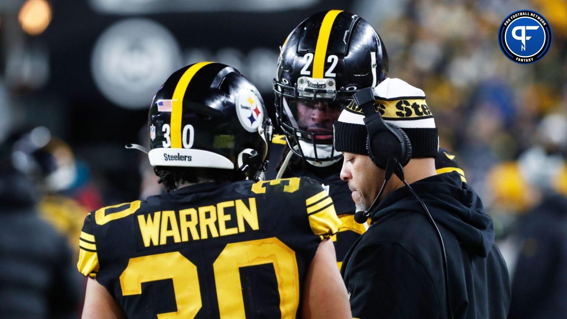 Pittsburgh Steelers running backs Jaylen Warren (30) and Najee Harris (22) talk with running backs coach Eddie Faulkner (right) on the sidelines against the New England Patriots during the third quarter at Acrisure Stadium.