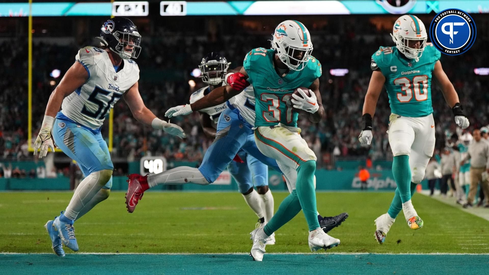 Miami Dolphins running back Raheem Mostert (31) runs for a touchdown against the Tennessee Titans during the second half at Hard Rock Stadium.